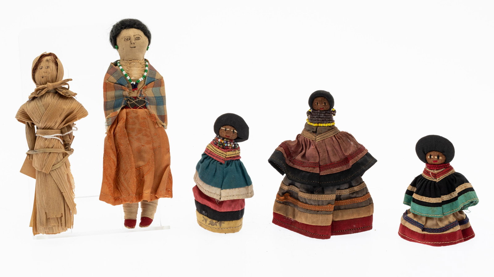 5 Cloth and Corn Husk Native American Dolls: Property from the Collection of John and Virginia Duncan, Savannah, GA Description: 5 Cloth and Corn Husk Native American Dolls, comprising a 5 in. cloth and husk doll, a 3 1/2 in. cloth and husk