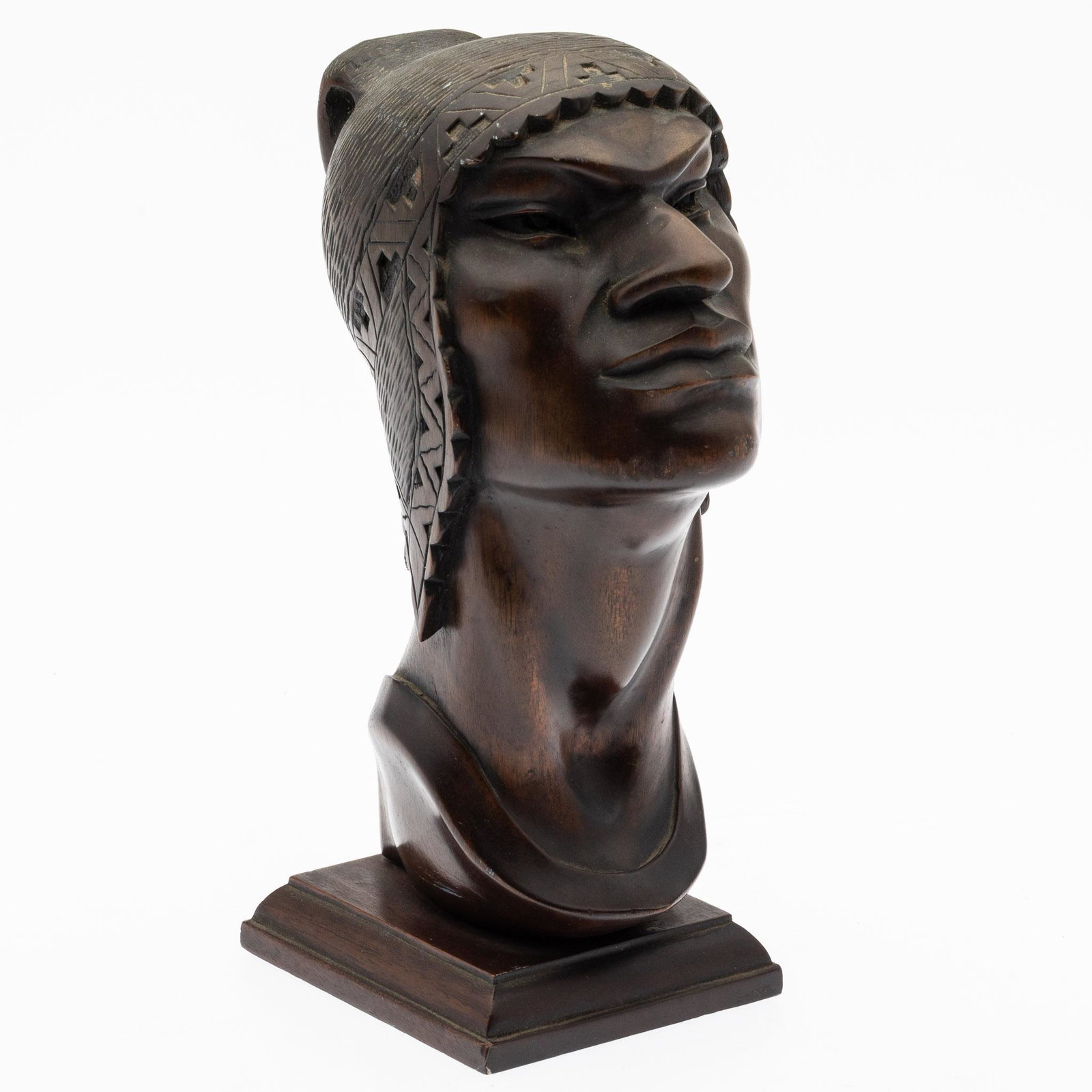A. Franco (Bolivian, 20th C), Wood Bust of a Man: Property from the Collection of John and Virginia Duncan, Savannah, GA Description: A. Franco (Bolivian, 20th C), Carved Wood Bust of a Man, signed on neck near base, depicting a man with woven he