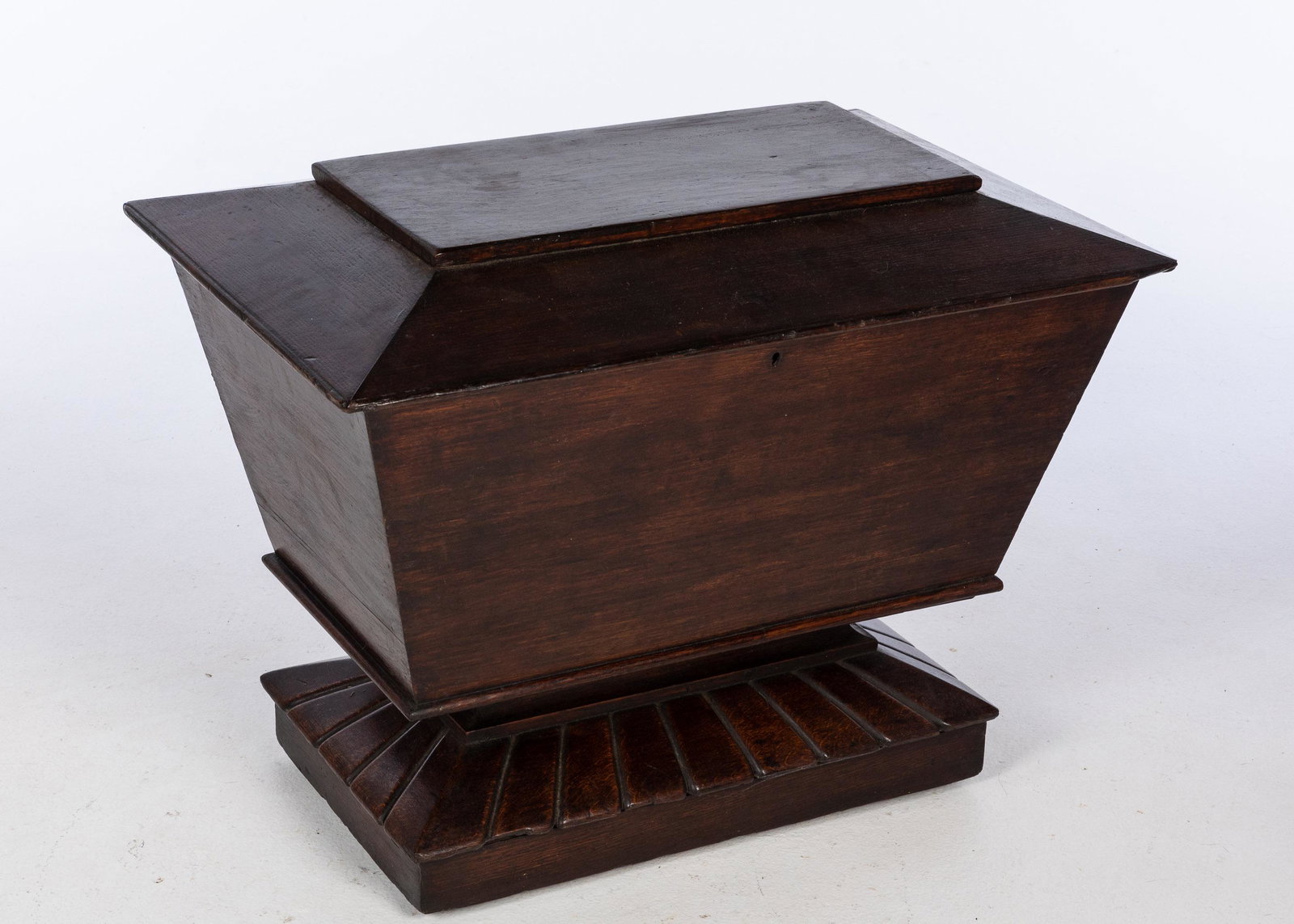 English Oak Cellarette, mid 19th Century: Property from the Collection of Alex Raskin, Savannah, GA Description: English Oak Cellarette, mid 19th Century, of rectangular form with hinged top, on a reeded platform base. Measureme