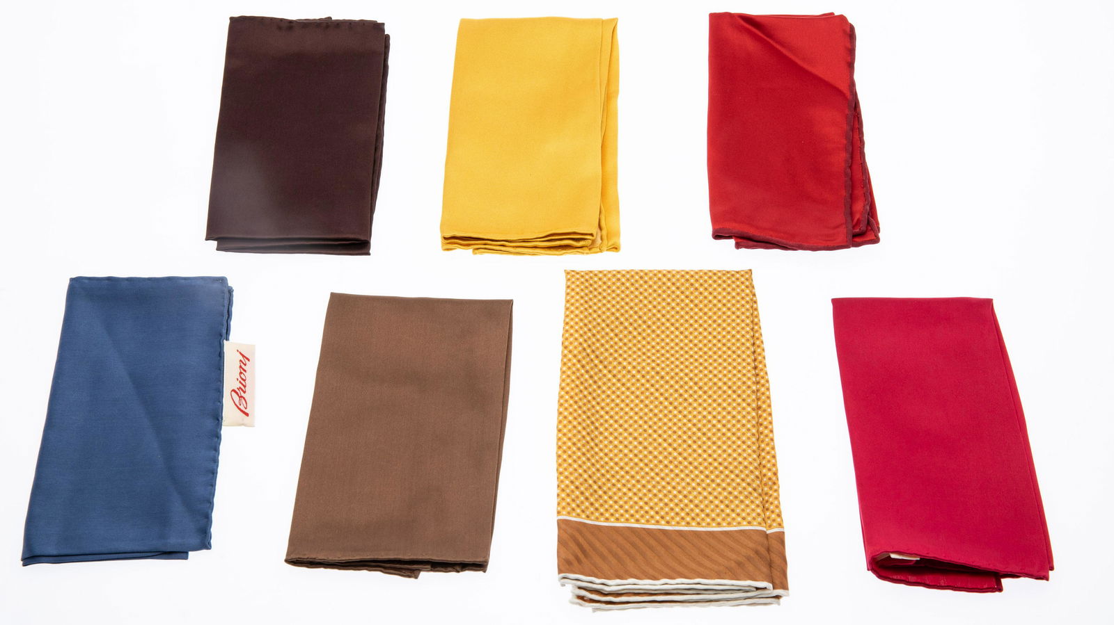 7 Brioni Silk Pocket Squares: Property from a Private Collection, Palm Beach Florida Description: 7 Brioni Silk Pocket Squares, one with brown and white polka dots on a yellow ground with white and brown border, Brioni blocked