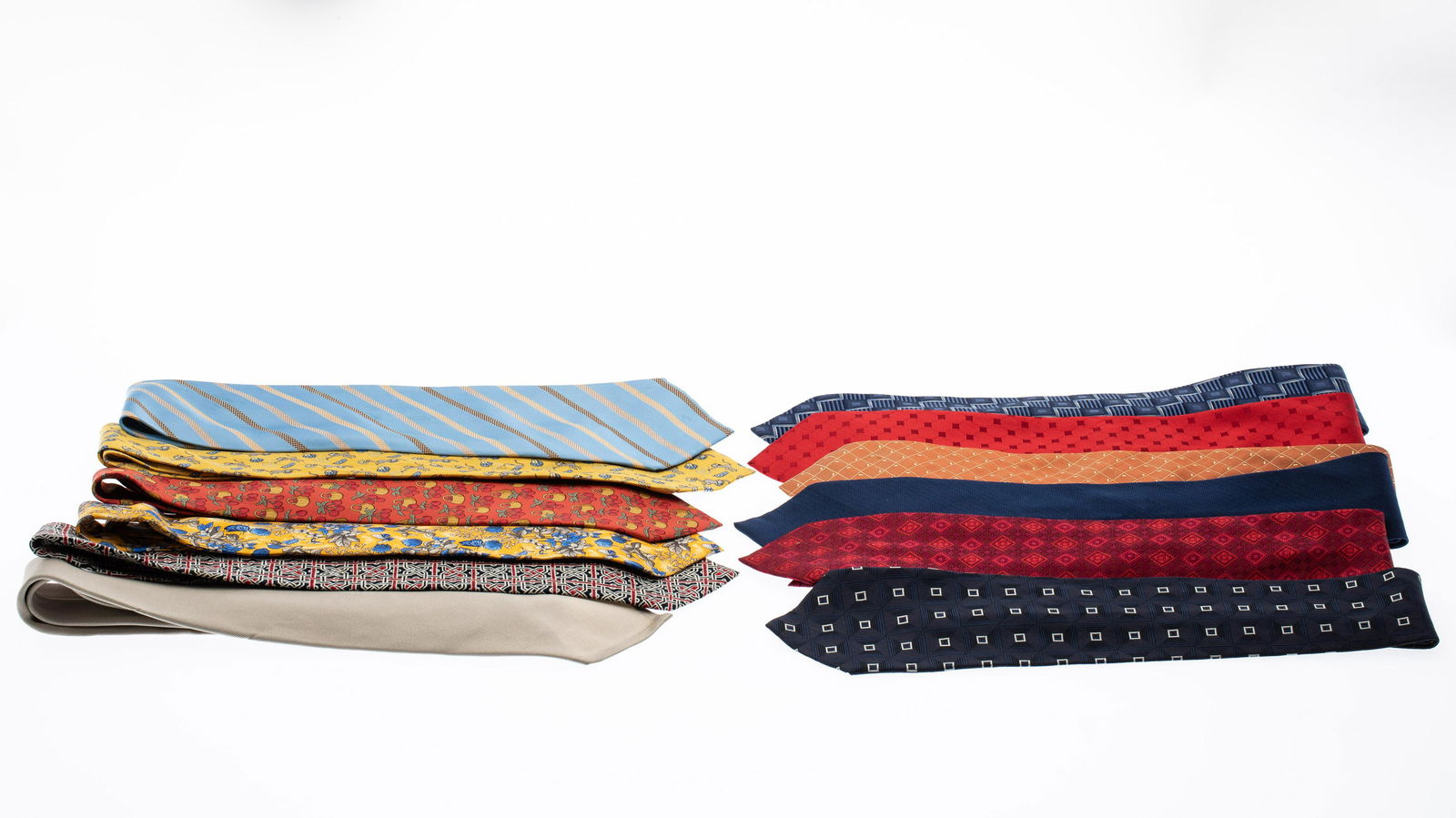 12 Various Maker Silk Ties, including Hermes: Property from a Private Collection, Palm Beach Florida Description: 12 Various Maker Silk Ties, including Hermes, comprising a blue patterned Gusken tie, an orange Escada tie, a khaki Polo by Ralp