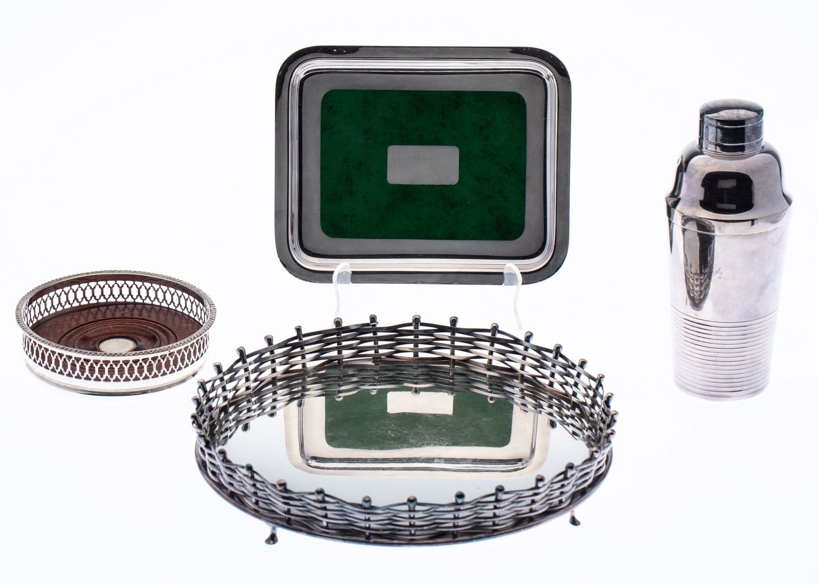 Group of Silverplate Barware, 4 pcs.: Property from a Private Collection, Palm Beach Florida Description: Group of Silverplate Barware, 4 pcs., comprising a silverplate cocktail shaker, a wood and silverplate wine coaster, an 8 1/4 in