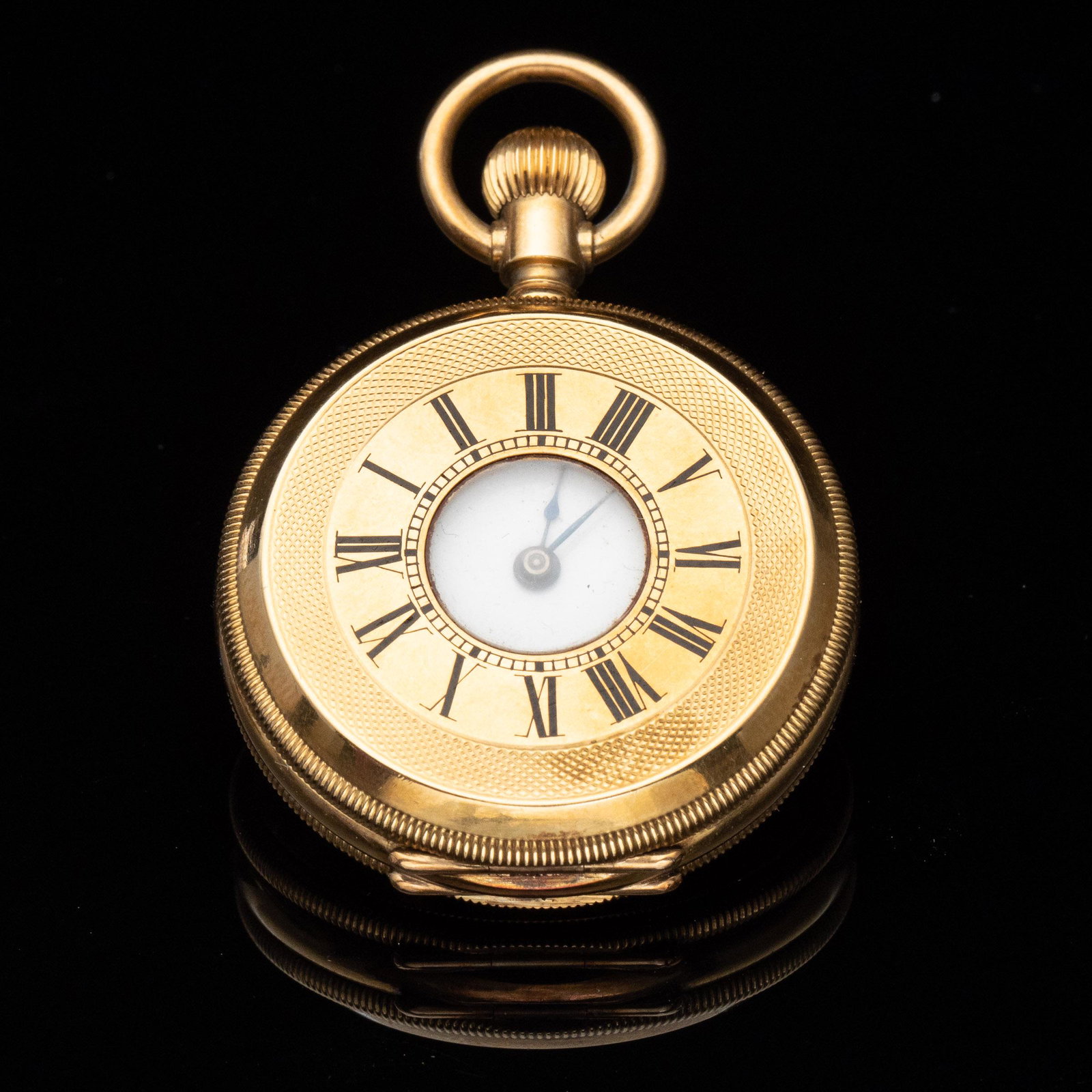 Tiffany 18k Gold Woman's Pocket Watch: Property from a Private Collection, Dataw Island, SC Description: Tiffany 18k Gold Woman's Pocket Watch, in a half-hunter case with roman numerals dial, the white enamel face marked 'Tiffany & Co.