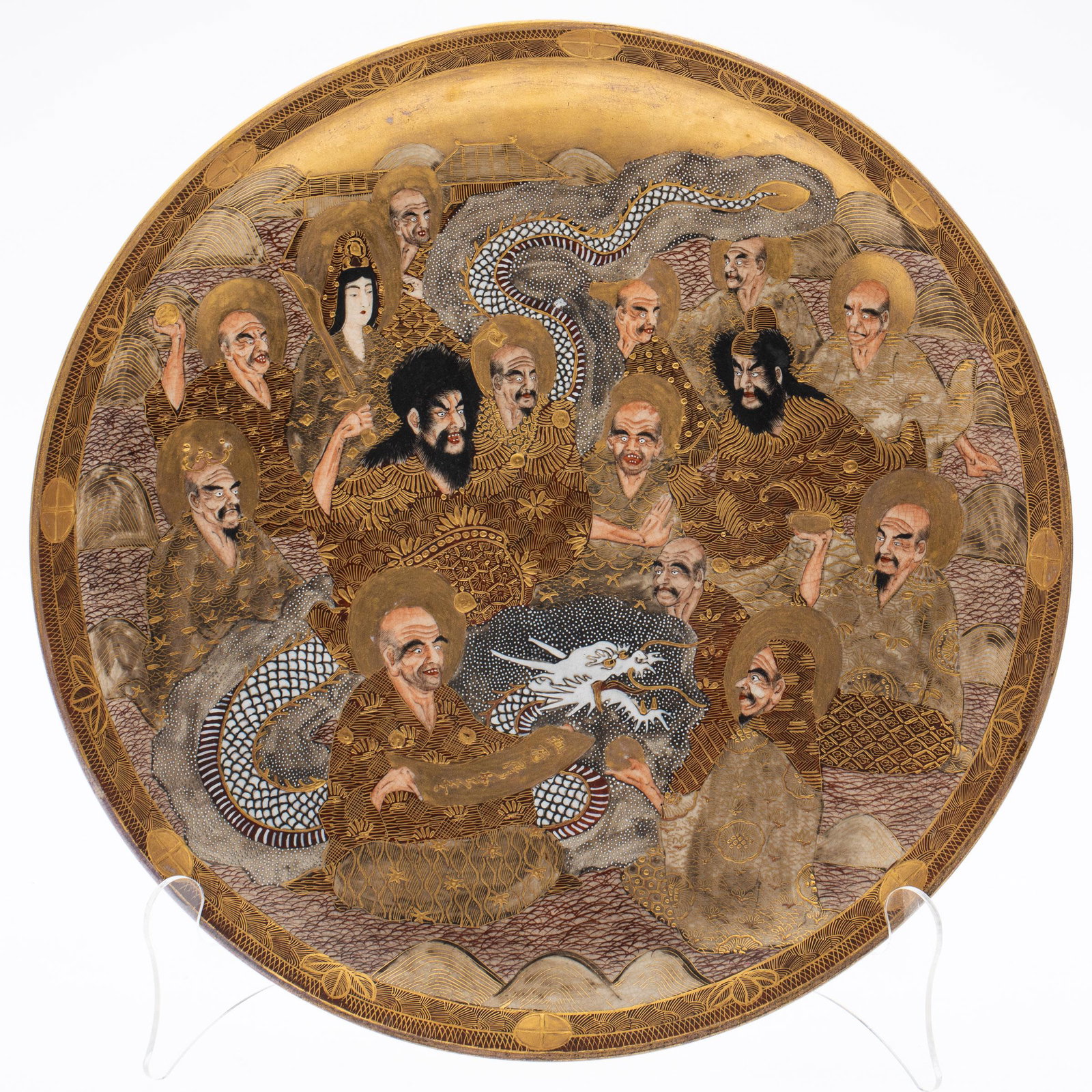 Japanese Satsuma Plate, Meiji, 19th Century: Property of a Okatie, SC Estate Description: Japanese Satsuma Plate, Meiji, 19th Century, depicting the faces of haloed immortals with dragon, signed and stamped on verso. Measurements: