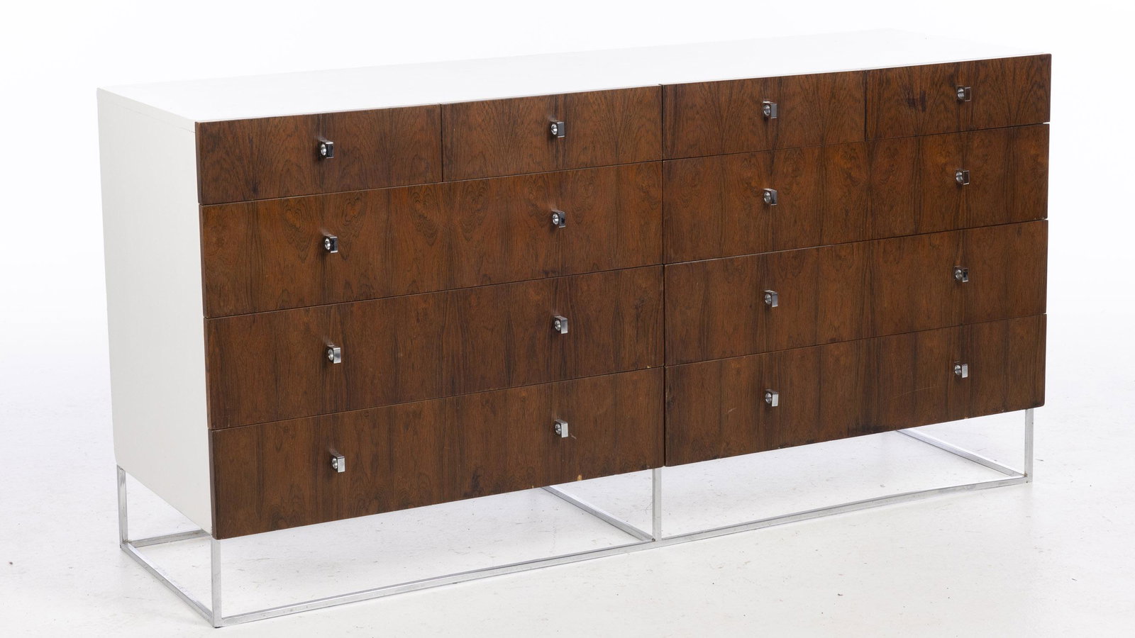 Milo Baughman Style Rosewood Dresser: Property from the Collection of Noted Interior Designer Chuck Chewning Description: Milo Baughman Style Rosewood Dresser , rosewood, chrome and white painted ten drawer dresser, the rectangular to