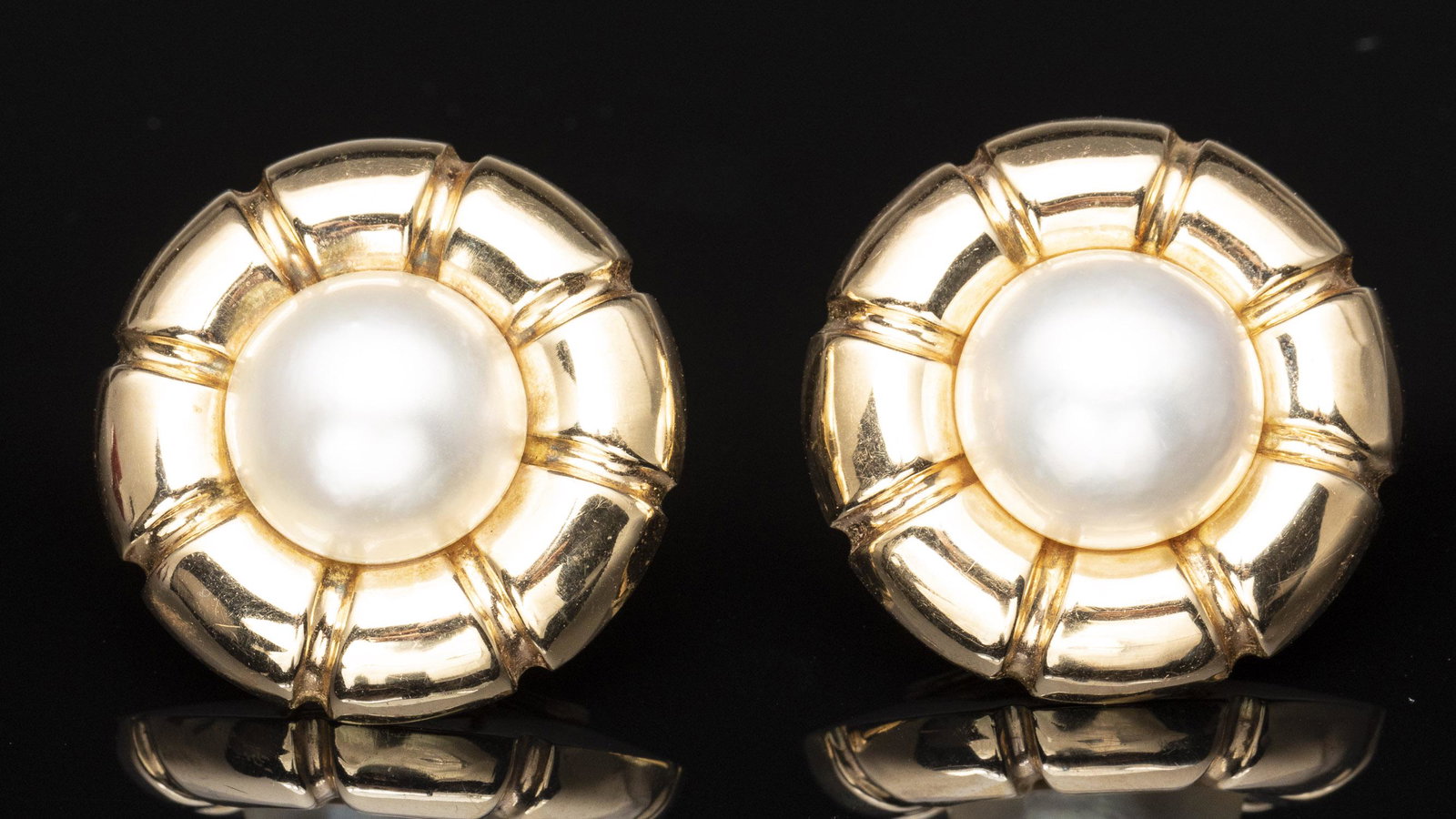 Mabe Pearl and 14K Gold Earrings: Property from a Jacksonville, FL Private Collection Description: Mabe Pearl and 14K Gold Earrings, 14 mm mabe pearls in a 14k gold surround, with stud and clasp backs, marked '585' and 'Spain' on