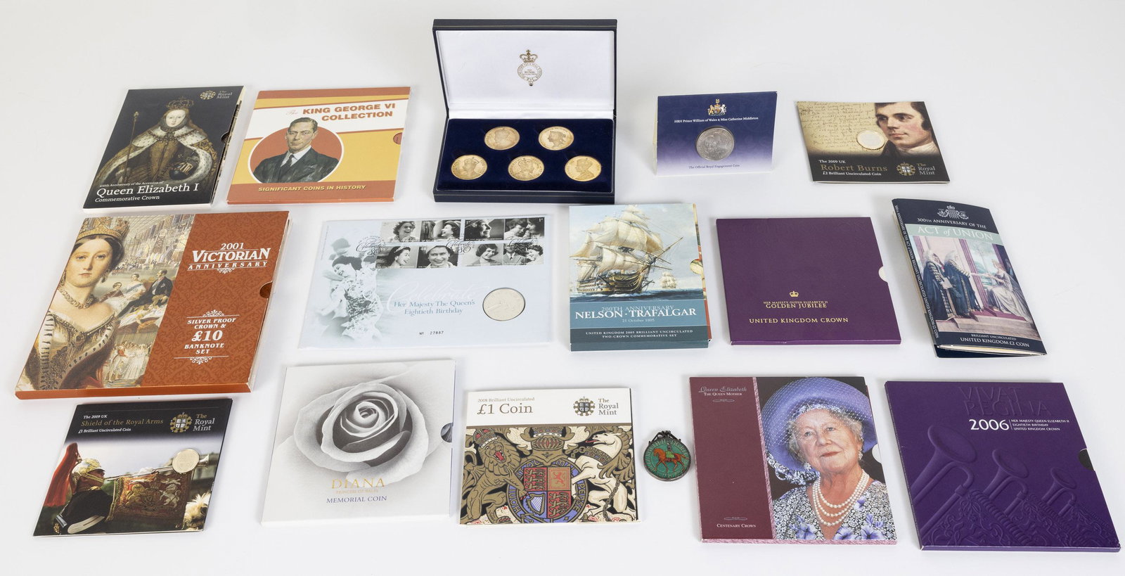 14 Commemorative Coins in Booklets and a Coin Set: Property of a Private Collector, Hilton Head Island, South Carolina Description: Group of 14 Commemorative Coins in Booklets and a Coin Set, comprising a 200th Anniversary Nelson Trafalgar 2005 un