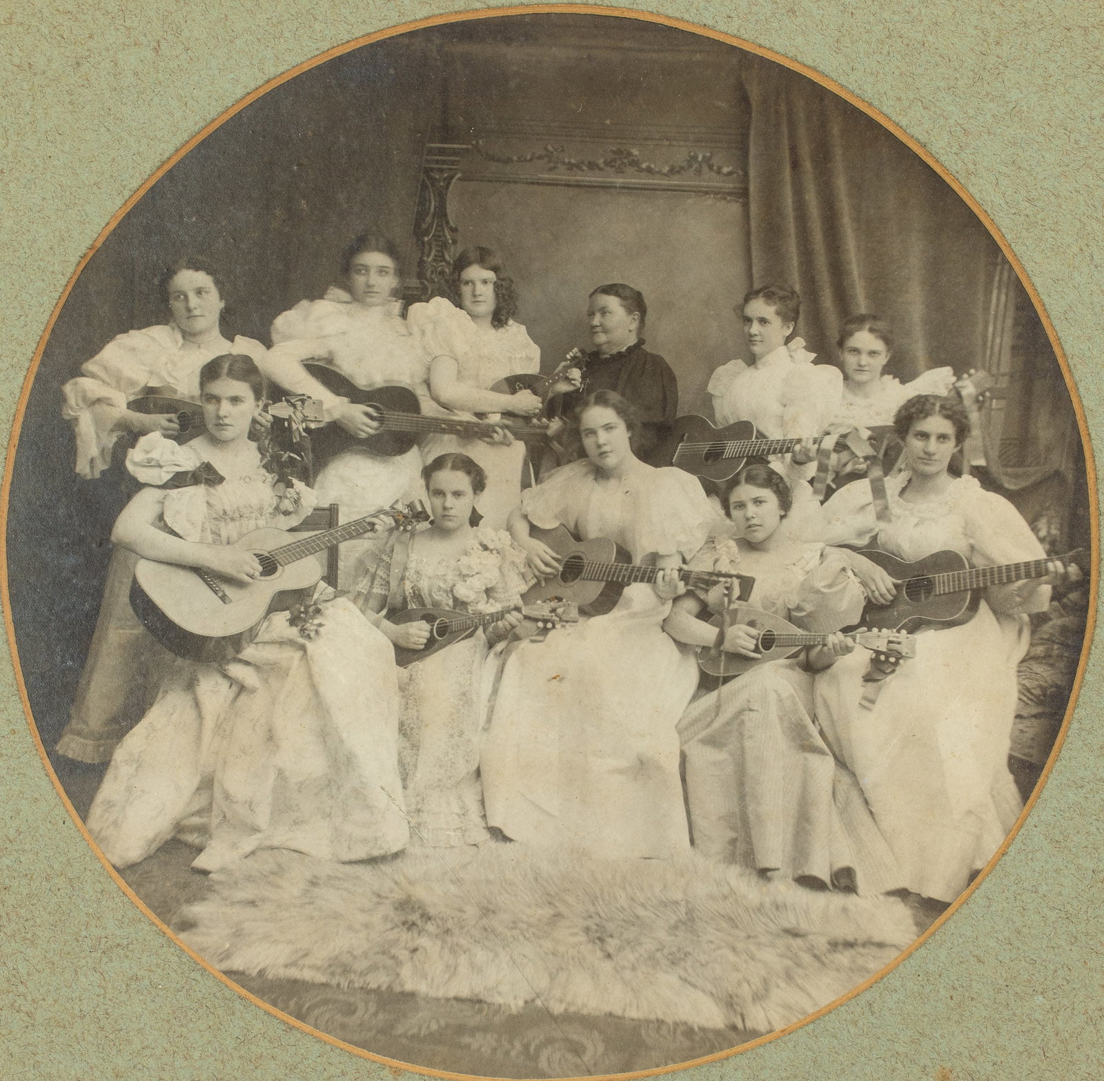 Vintage Photograph of Ladies String Band: Description: Vintage Photograph of Ladies String Band, vintage photograph depicting a group of young women posing with their guitars, matted and framed. Frame size: 18 in. x 18 in. Meas