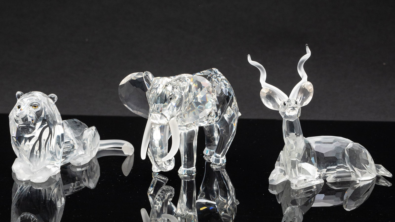 Swarovski Crystal Lion, Kudu and Elephant: Property from a South Carolina Estate Description: Swarovski Crystal Lion, Kudu and Elephant, comprising a 2 1/2 in. lion (1995), a 3 1/4 in. elephant (1994) and a 3 3/4 in. kudu (1993), from the