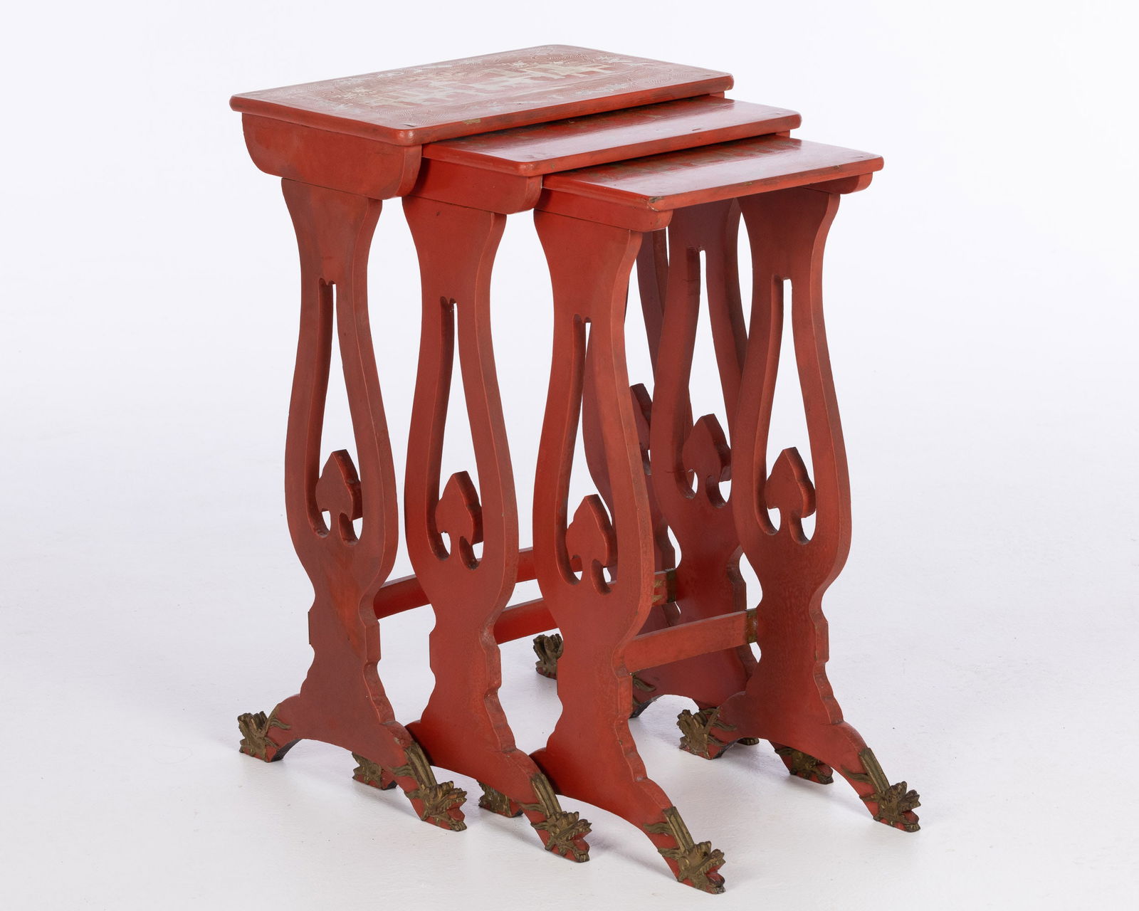 3 Chinese Export Style Red Lacquer Nesting Tables: Property from a Savannah, GA Estate Description: Three Chinese Export Style Red Lacquer and Parcel Gilt Nesting Tables, 20th century, each depicting figures in a Pavilion scene within borders of s