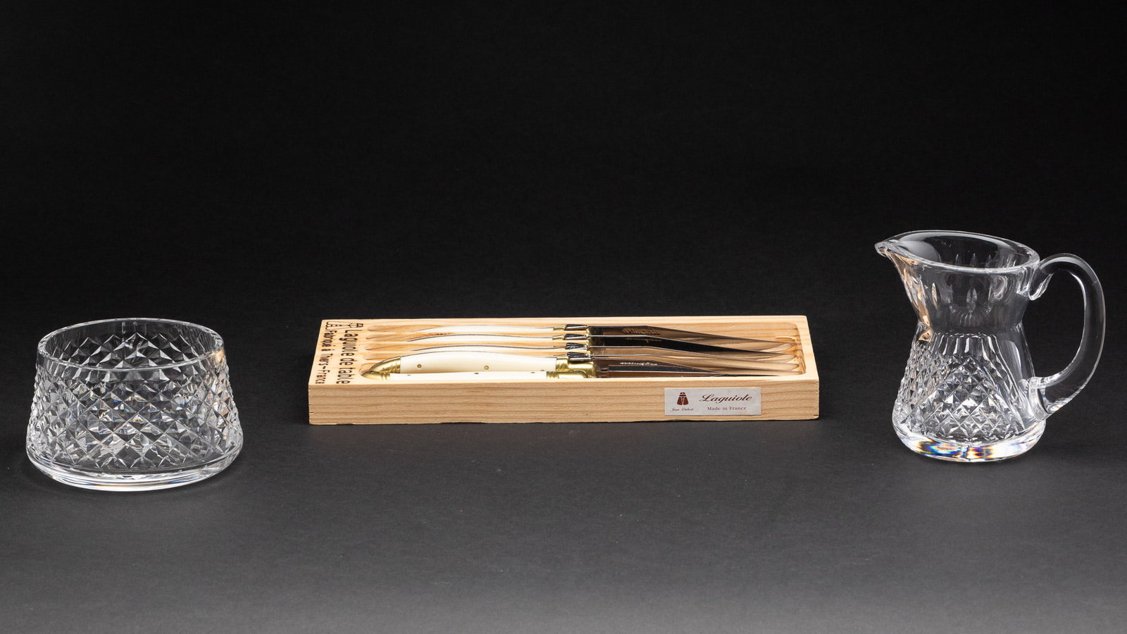 Waterford Cream & Sugar & 6 Laguiole Steak Knives: Property from a Private Collection, Hilton Head Island, SC Description: Waterford Glass Cream & Sugar & 6 Laguiole Steak Knives. Measurements: Height: of creamer 4 1/8 in. x Wid