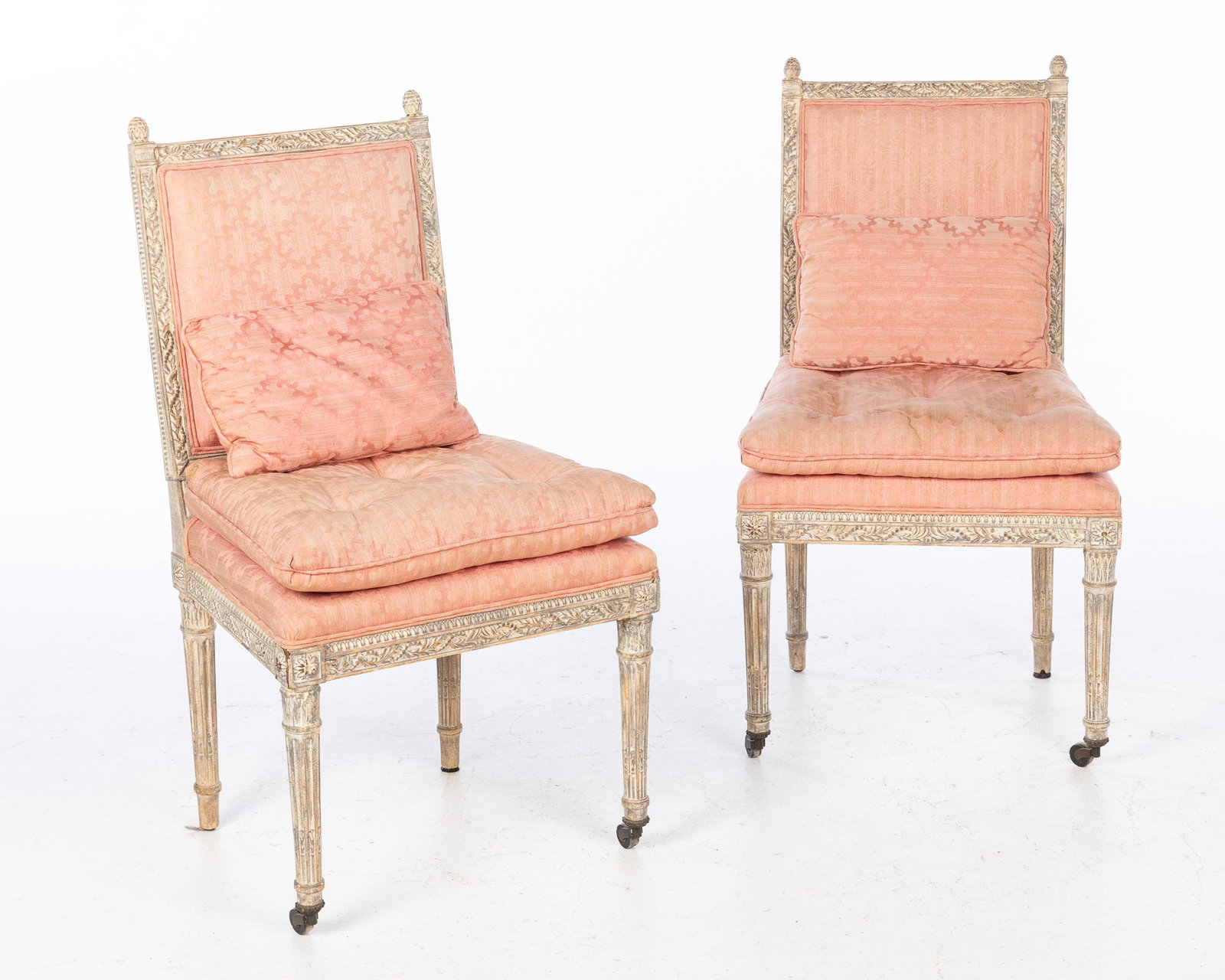 Pair of Louis XVI Style Painted Side Chairs, 20th C: Property from a Private Collection, Savannah, GA Description: Pair of Louis XVI Style Painted Side Chairs, 20th C, each with pink upholstery raised on stop-fluted legs on casters. Measur