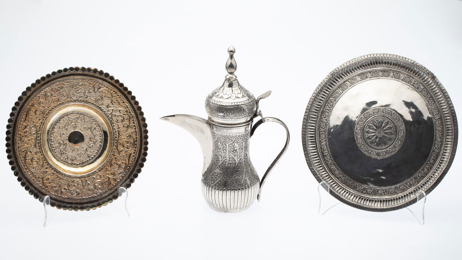 Saudi Silvered-Metal Coffee Pot and 2 Trays: Property from the Estate of a Former General Electric International Executive, Hilton Head Island, SC Description: Saudi Silvered-Metal Coffee Pot and 2 Trays, a coffee pot with onion dome cover,