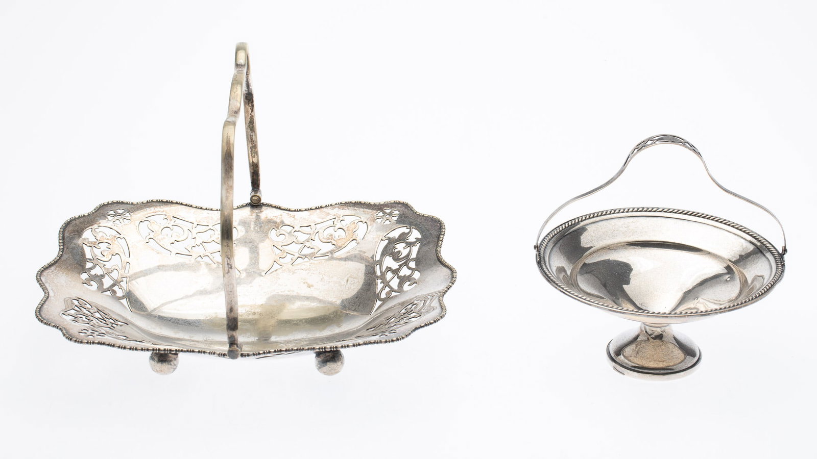 2 Silver Baskets: Property from the Estate of Jeannie Sims, Savannah, GA and Charleston, SC Description: 2 Silver Baskets, both handled, the larger silverplate basket with pierced design, marked 'EPNS,' the smaller