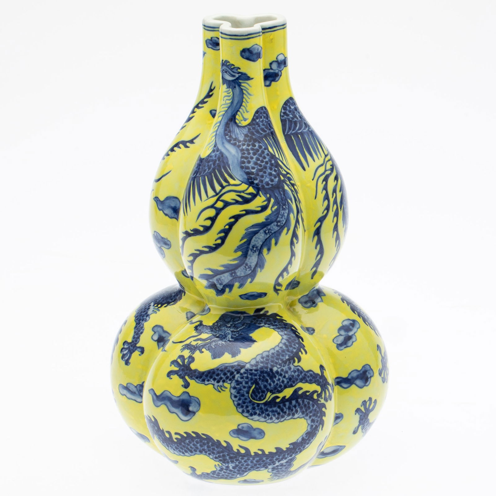 Chinese Blue and Yellow Gourd Form Bottle Vase: Property from the Estate of a Former General Electric International Executive, Hilton Head Island, SC Description: Chinese Blue and Yellow Gourd Form Bottle Vase, the shaped vase decorated with bl