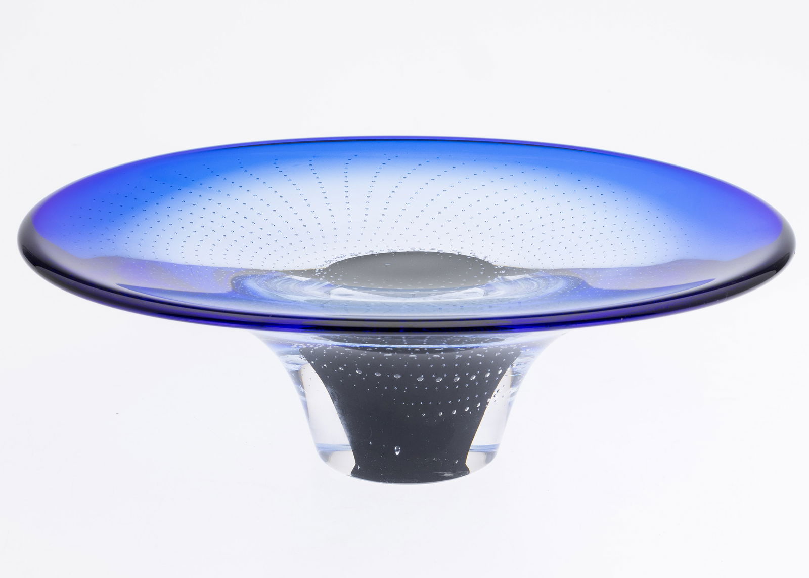 Goran Warff for Kosta Boda Glass Bowl: Description: Goran Warff for Kosta Boda Glass Bowl, inscribed '86 Waat 987005/100 Kosta Boda Goran Warff Atelier' on bottom, dark blue footed glass bowl with interior bubble design. Mea