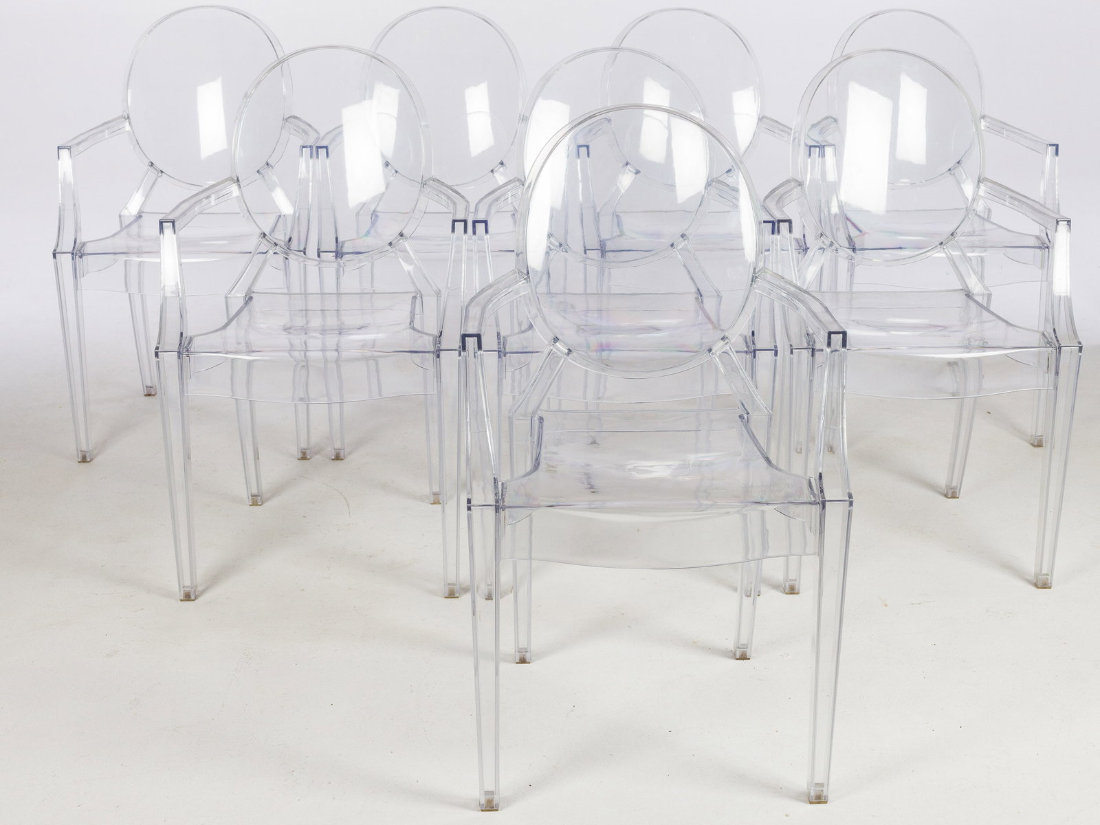 8 Modern Philippe Starck Style Louis Ghost Armchairs: Description: 8 Modern Philippe Starck Style Louis Ghost Armchairs, unmarked, with oval back on square tapering legs. Measurements: Height: 36 in. x Width: 21 in. x Depth: 19 in