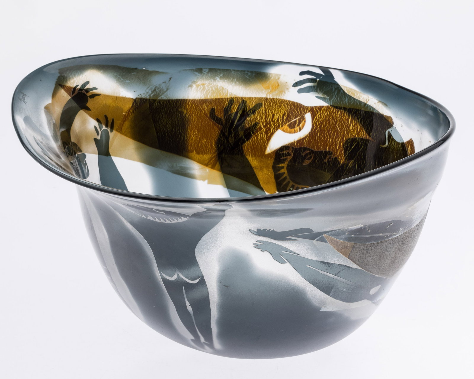Steven Newell (b. 1948), Art Glass Bowl with Figures: Description: Steven Newell (American, b. 1948), Art Glass Bowl with Figures, organic form art glass bowl decorated with various black and gold-tone figures and faces, signed on the outer rim. <