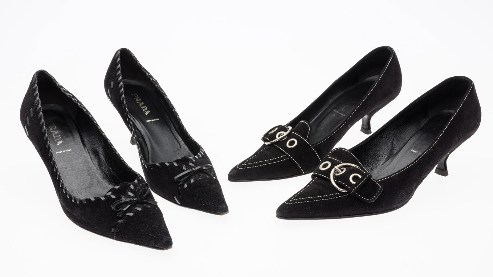 Two Pairs of Prada Suede Heels, Size 41: Property from a Private Collector, New York City Description: Two Pairs of Prada Suede Heels, Size 41, including a pair of black suede heels with bow with laced stitching detail, 2 1/4 in. heel, m