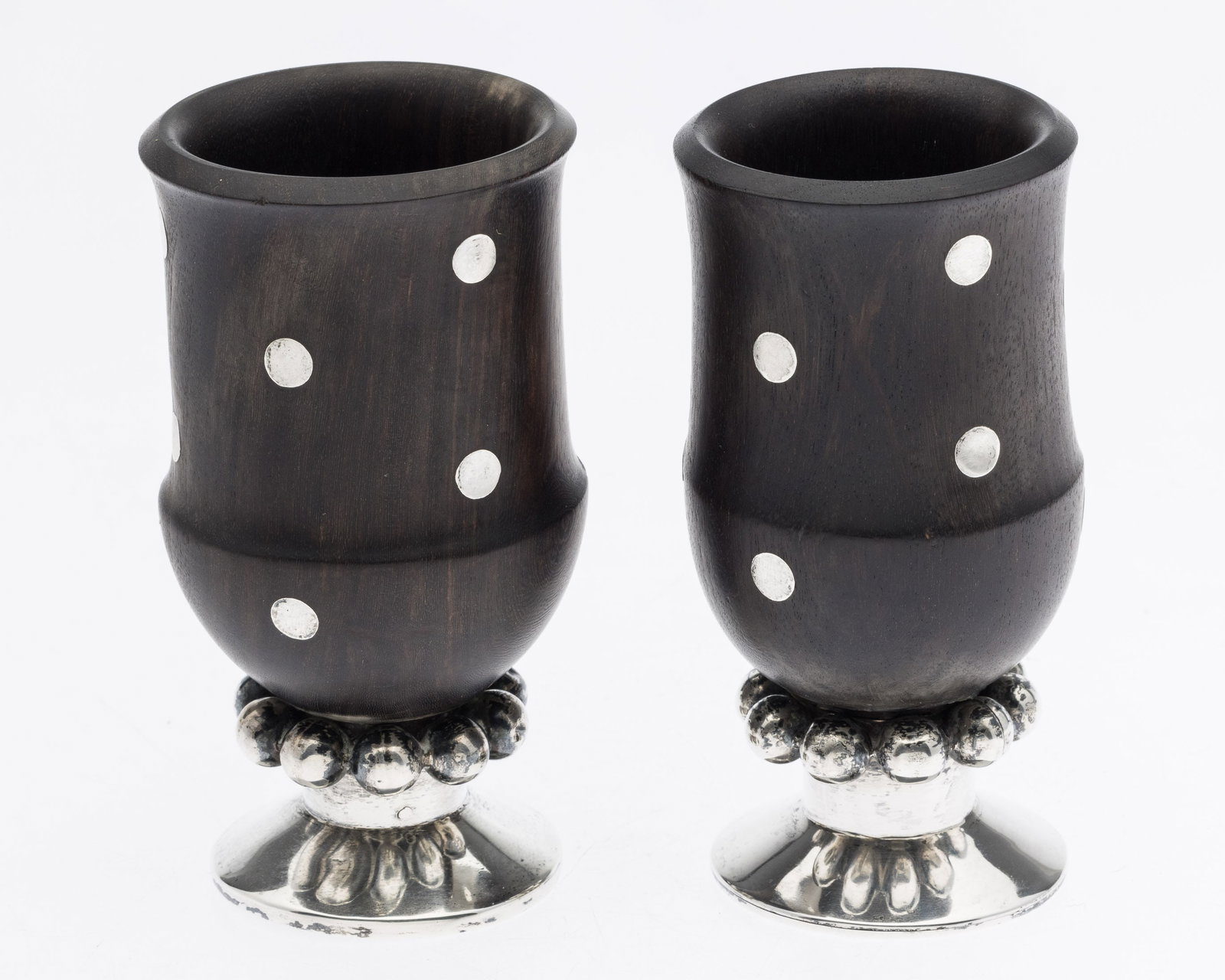 Pair of Spratling Sterling Silver and Wood Cups: Property from the Estate of Lorlee and Arnold Tenenbaum Description: Pair of Spratling Sterling Silver and Wood Cups, with sterling silver beaded accents towards the stem with various inlaid silve