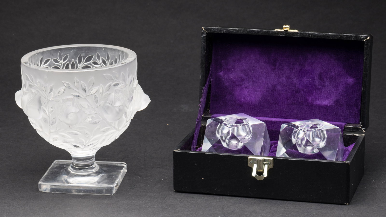 Lalique Glass Elizabeth Vase & 2 Glass Votives: Property from the Estate of Lorlee and Arnold Tenenbaum Description: Lalique Glass Elizabeth Footed Vase and 2 Glass Votives, comprising a Lalique Elizabeth footed vase, signed Lalique France on v