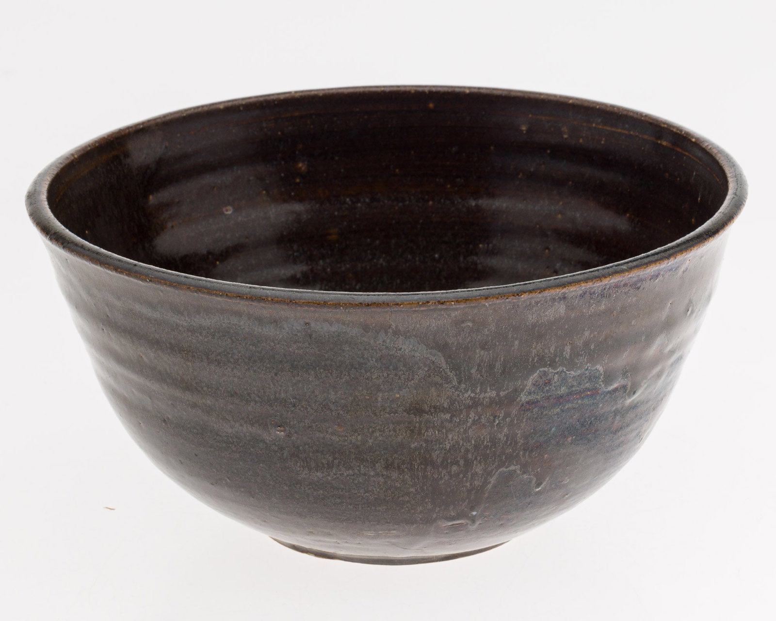 Toshiko Takaezu (American/Japanese, 1922-2011) Brown Glazed Bowl: Property of Private Collection, SC Description: Toshiko Takaezu (American/Japanese, 1922-2011), Brown Glazed Bowl, signed underneath with artists monogram initials 'TT', brown glaze with light bro