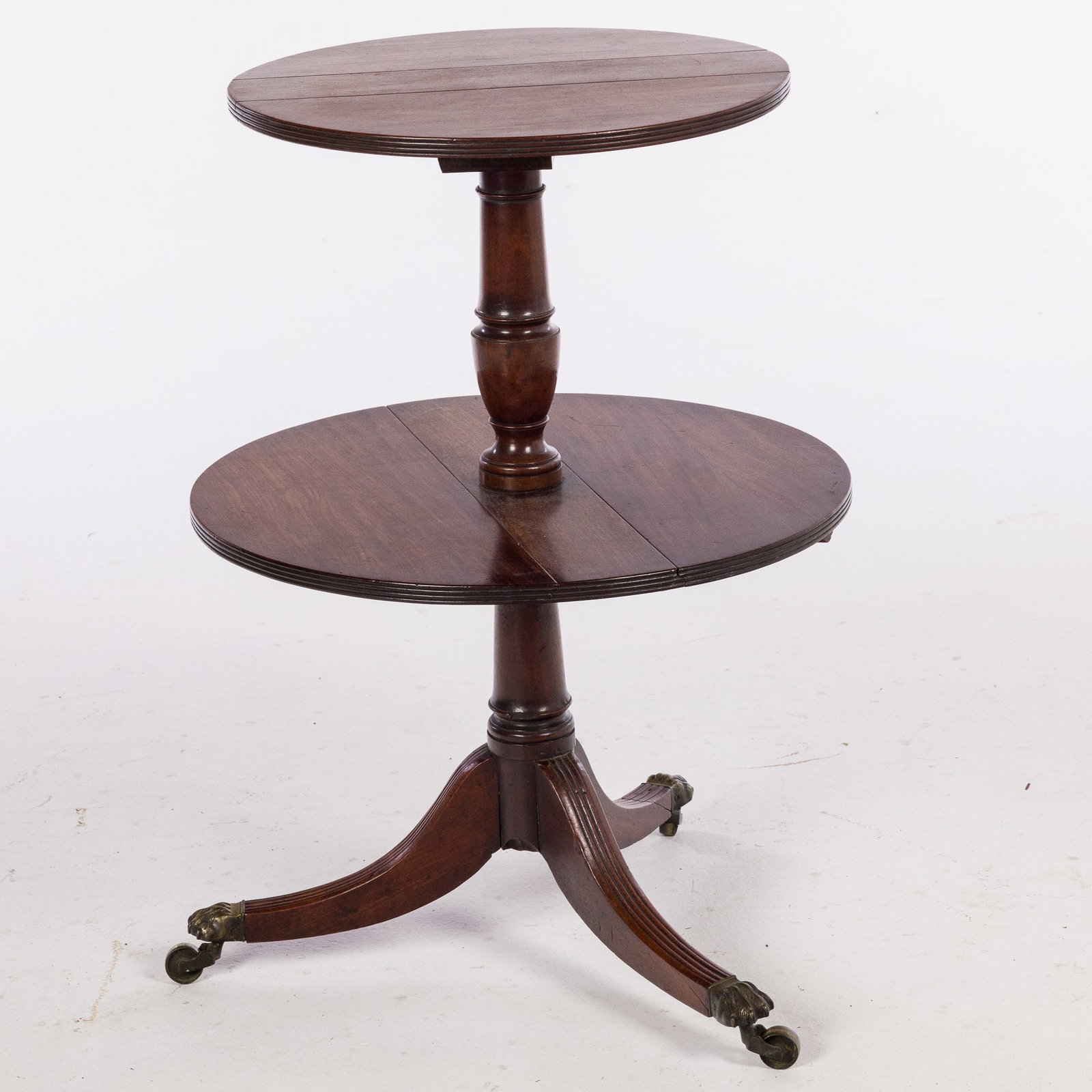 George III Mahogany Drop Leaf Dumbwaiter, Late 18th Century: Description: George III Mahogany Drop Leaf Dumbwaiter, Late 18th Century, with two graduated circular drop leaf tiers on an urn-form standard and downswept legs ending in animal paw caps and cast