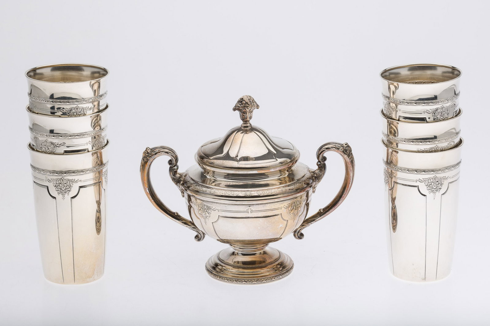 6 Towle Louis IV Sterling Tumblers and a Lidded Sugar: Property of a Private Collector, Savannah, GA Description: 6 Towle Louis IV Sterling Tumblers and a Lidded Sugar, comprising 6 Towle sterling Louis IV pattern 5 1/8 in. x 3 in. tumblers (each with