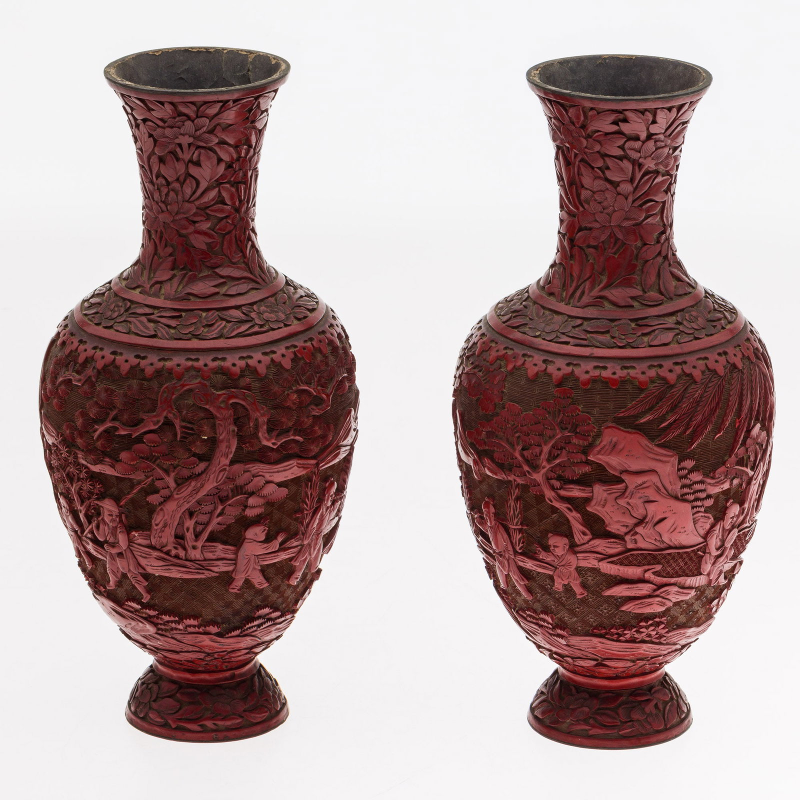 Pair of Chinese Cinnabar Vases: Property of a Dataw Island, SC Estate Description: Pair of Chinese Cinnabar Vases, carved with scenes of figures in landscapes with floral motifs on necks and feet, unmarked. Measurement