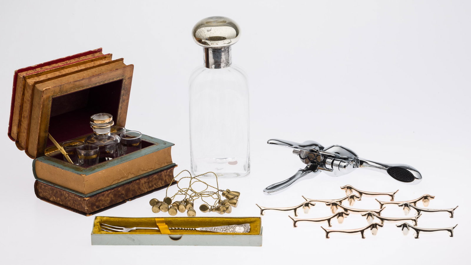 Group of Desk and Table D?cor: Property from the Collection of Bob Herron, Savannah, Boston and Paris Description: Group of Desk and Table D?cor, comprising book-form hidden liqueur set with hinged lid opening to small decanter
