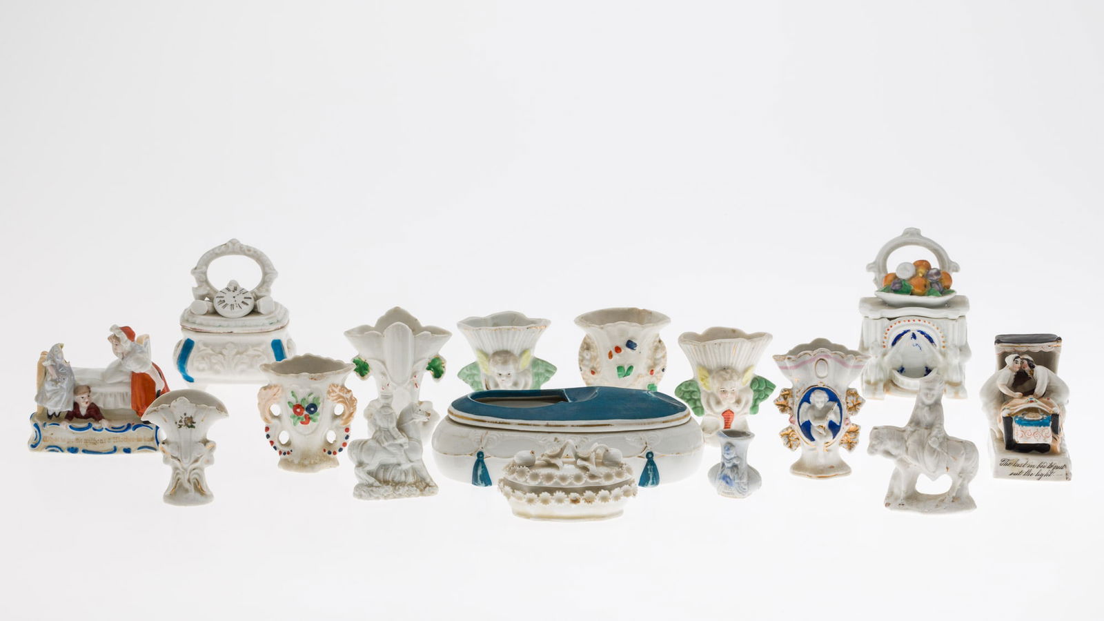 Group of Misc. Fairings and Porcelain Boxes: Description: Group of Misc. Fairings and Porcelain Boxes, comprising 8 various small fairings vases, three decorative boxes, two small figures on horseback, open lidded blue and white dish, and t