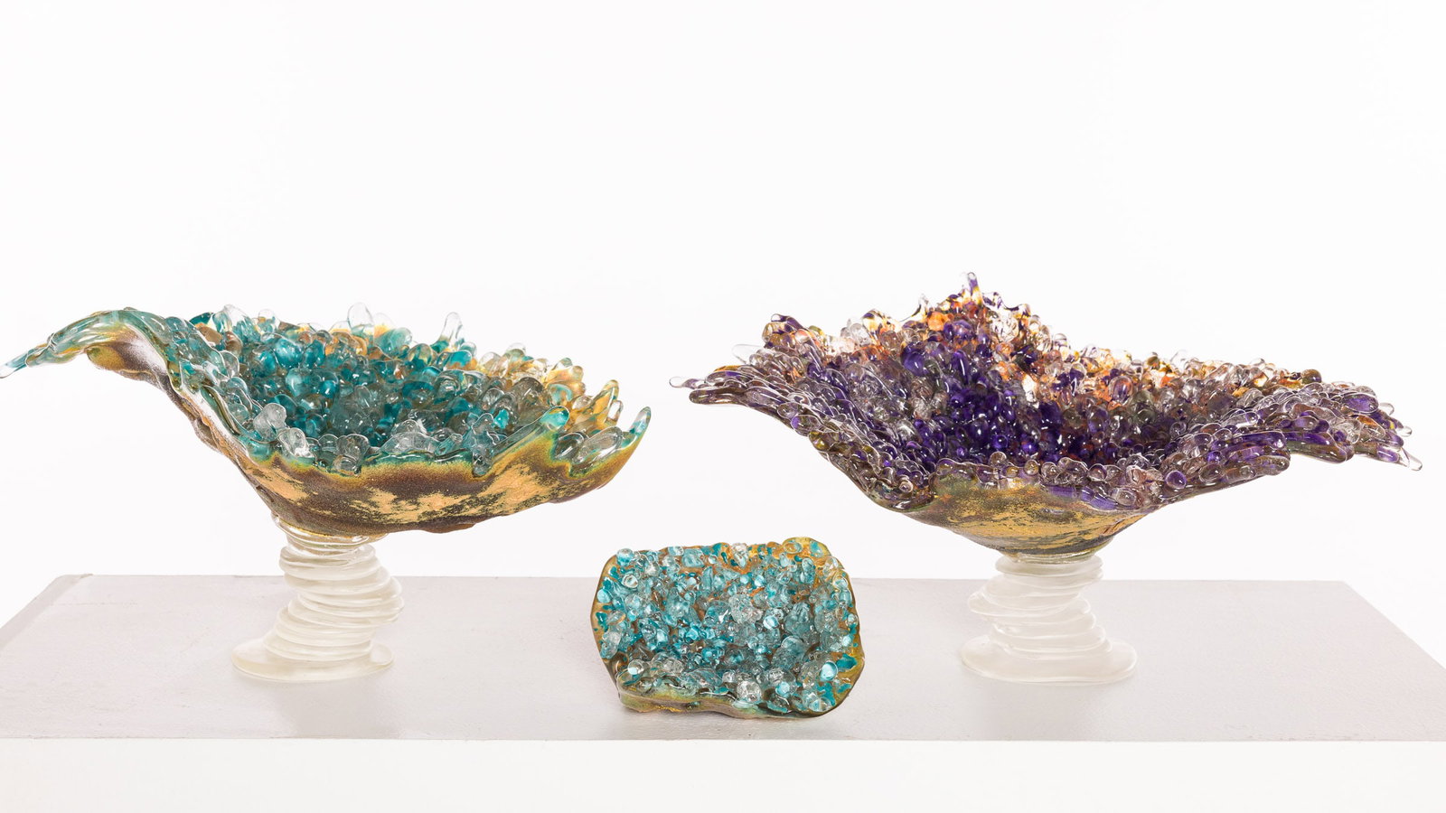 Three Blue Art Glass Bowls: Property from the Estate of Ann Lytle, Savannah, GA Description: Three Blue Art Glass Bowls, comprising a purple tone footed glass bowl with droplet texture, illegibly signed and dated 2011, a blu