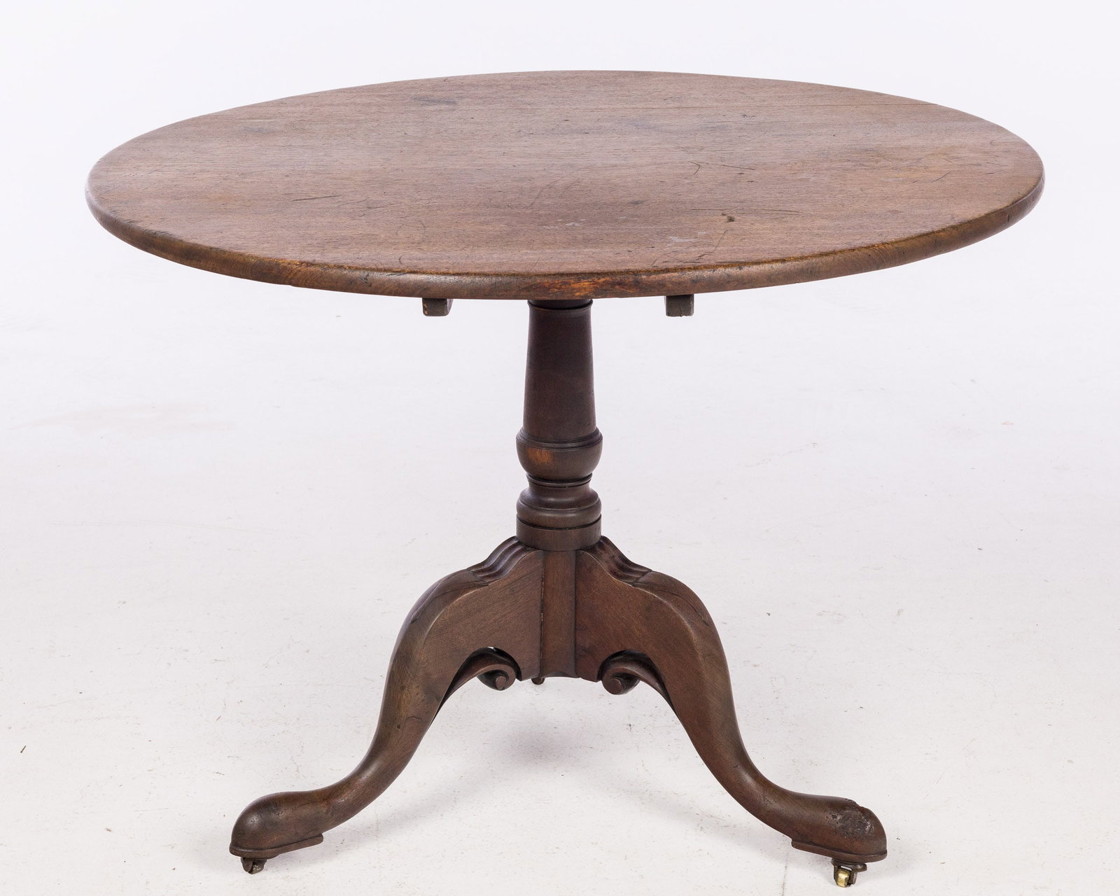 George III Mahogany Tilt Top Provincial Table: Property from a Collector, Philadelphia and New York Description: George III Mahogany Tilt Top Provincial Table, the circular top tilting above a circular flaring standard raised on downswept legs