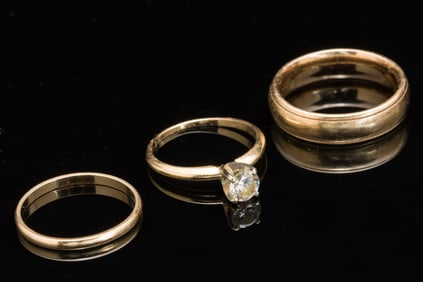 Men's Gold Wedding Band and a Diamond Engagement Ring and Band