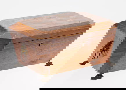 English Parquetry Box, 19th C: Description: English Parquetry Box, 19th C, the inlaid geometric top with banding and chamfered sides opening to a paper lined interior, the case with lion-form handles raised on animal paw