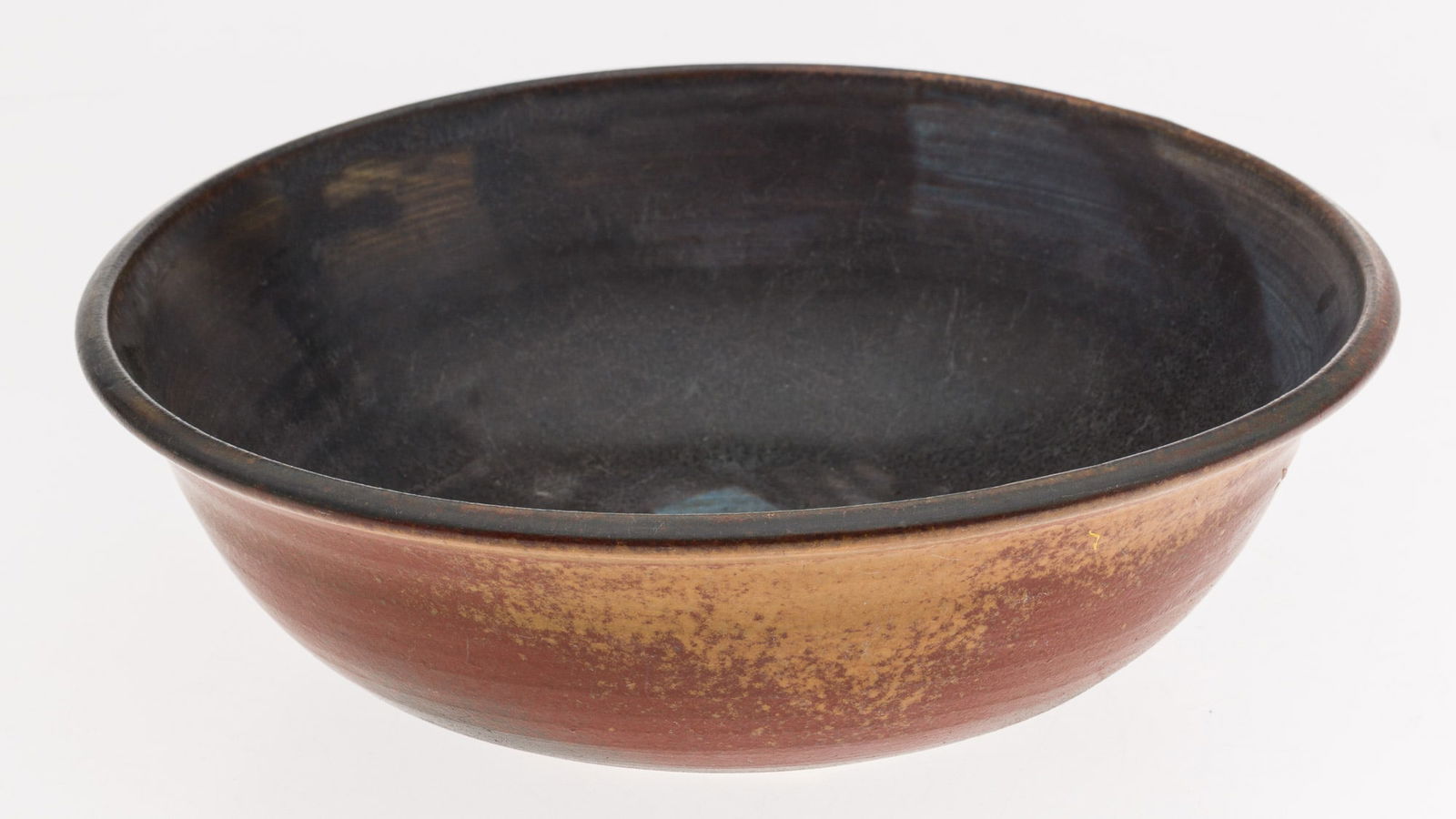 Toshiko Takaezu (1922-2011), Red and Black Glazed Bowl: Property of Private Collection, SC Description: Toshiko Takaezu (American/Japanese, 1922-2011), Red and Black Glazed Bowl, signed underneath with artists monogram initials 'TT', with dark blue and