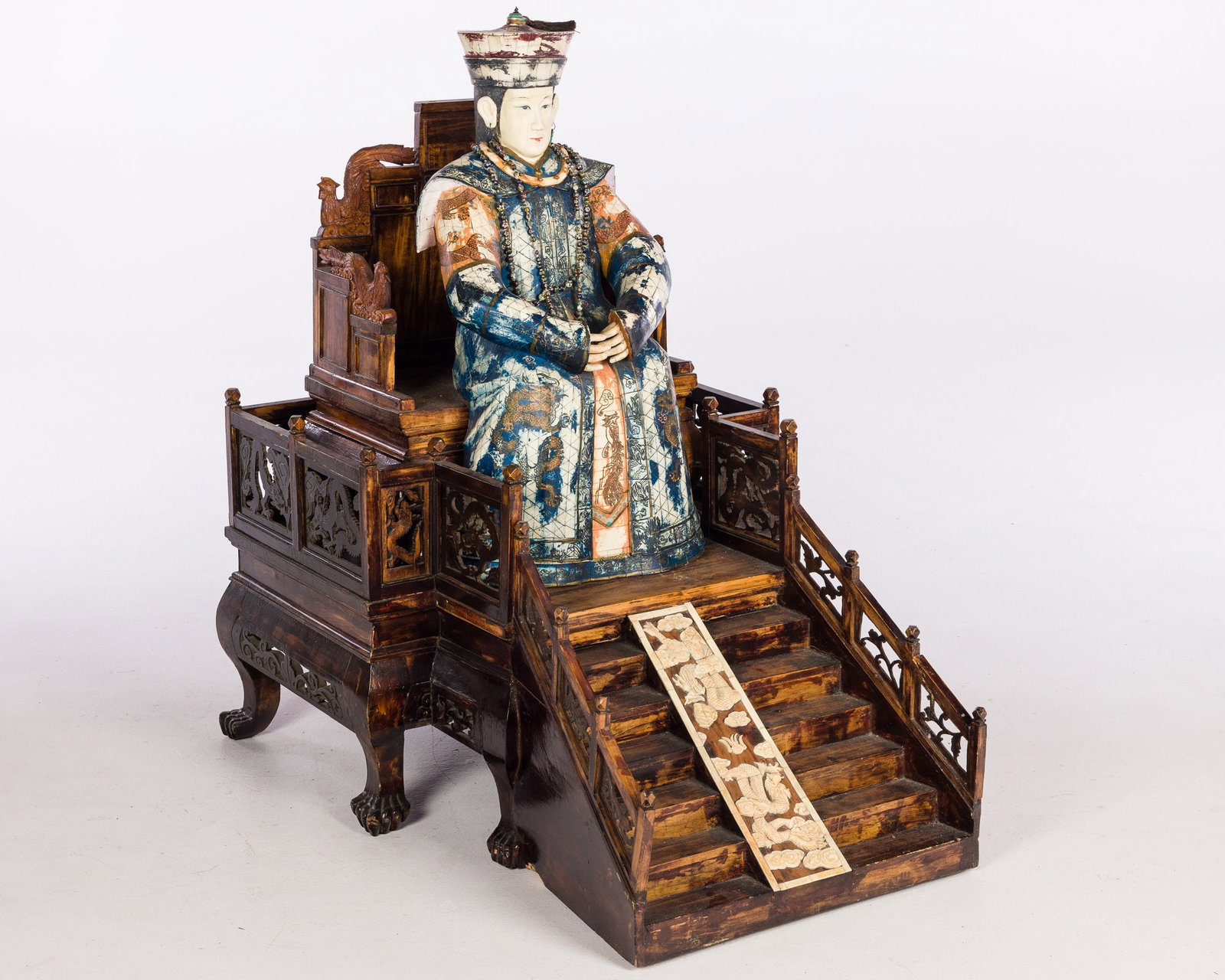 Large Seated Emperor and Empress on Stands: Property from the Betty Ann Mandus-Lane Revocable Trust, Port Orange, FL Description: Large Seated Emperor and Empress on Stands, the seated figures veneered in bone painted in red, blue and gold,