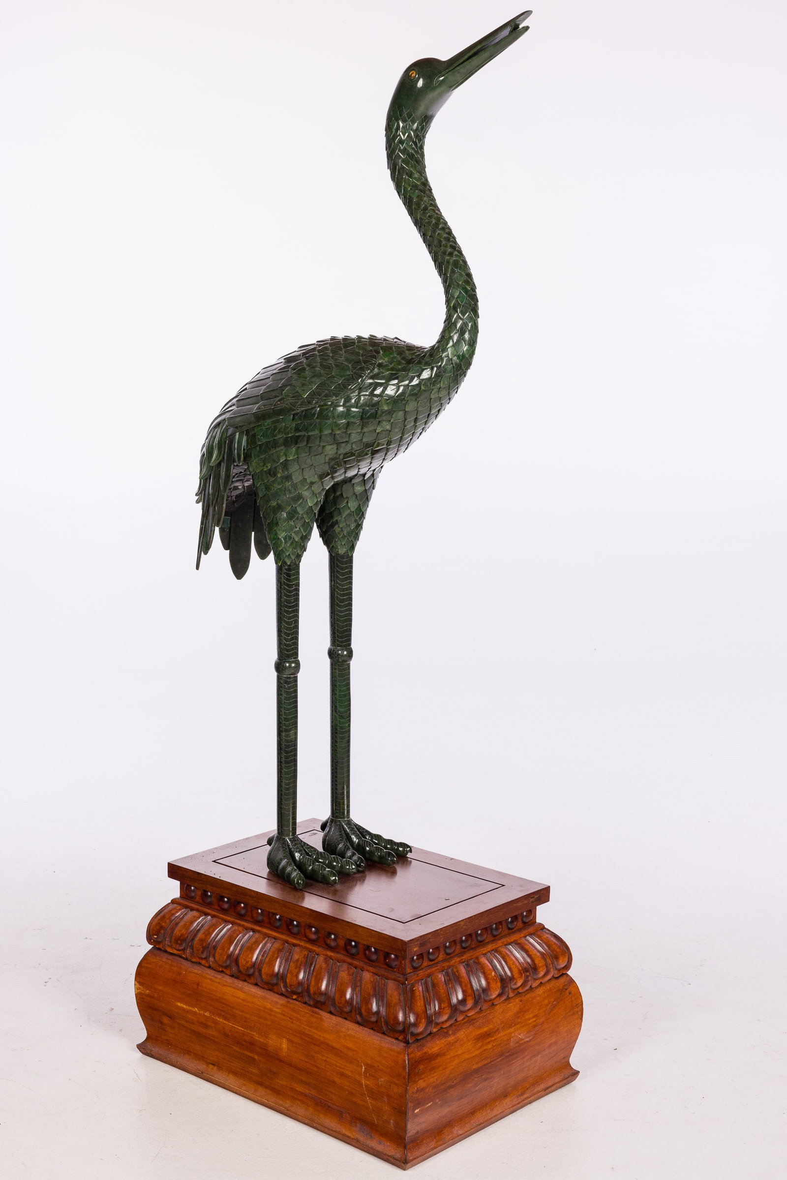 Monumental Chinese Green Jade Standing Crane: Property from the Betty Ann Mandus-Lane Revocable Trust, Port Orange, FL Description: Monumental Chinese Green Jade Standing Crane, the crane on a carved 15 3/8 in. wood base. Measuremen