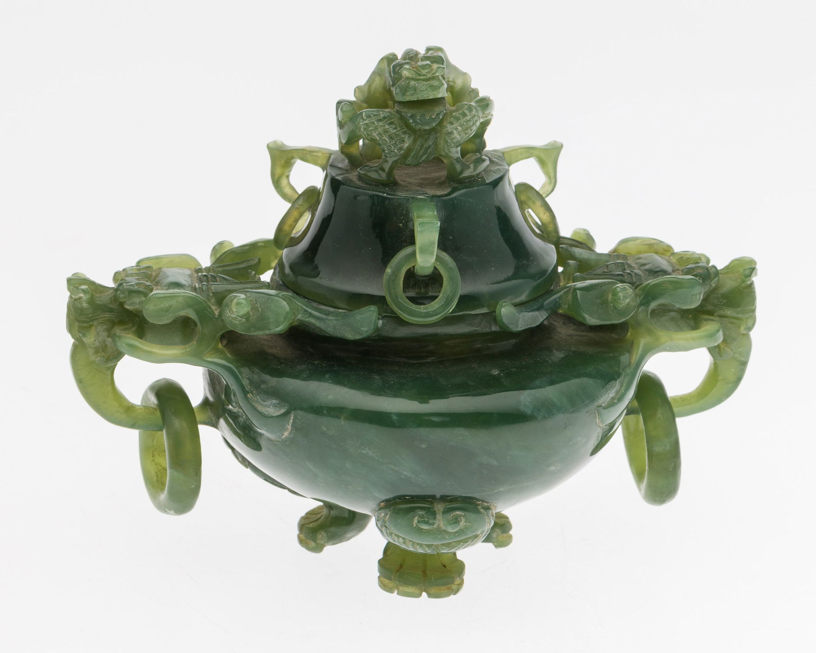 Chinese Green Quartz Censer: Property from the Betty Ann Mandus-Lane Revocable Trust, Port Orange, FL Description: Chinese Green Quartz Censer, tripod censer with dragon form handles and finial, with carved wood stand.