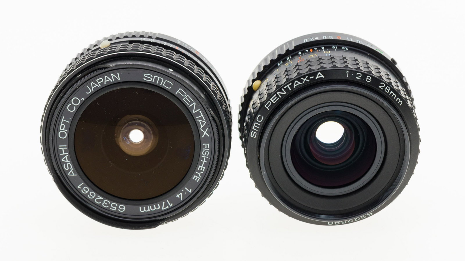 2 Pentax Lenses: Property from the Collection of Ray C. Cottingham Description: 2 Pentax Lenses, a SMC Pentax-A f2.8, 28mm, SN 5322588 and a SMC Pentax Fish-Eye f4, 17mm, SN 6532661, both with front and rear caps.