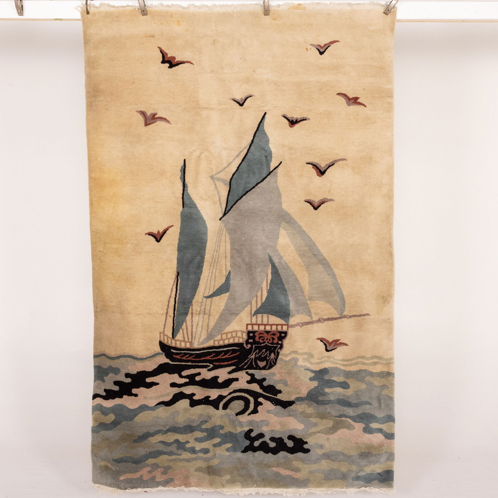 Chinese Wool Rug with Boat Motif: Description: Chinese Wool Rug with Boat Motif, in tones of light and dark blue on beige ground. Measurements: Height: 7 ft. 11 in. x Width: 5 ft. 2 in. x Depth: