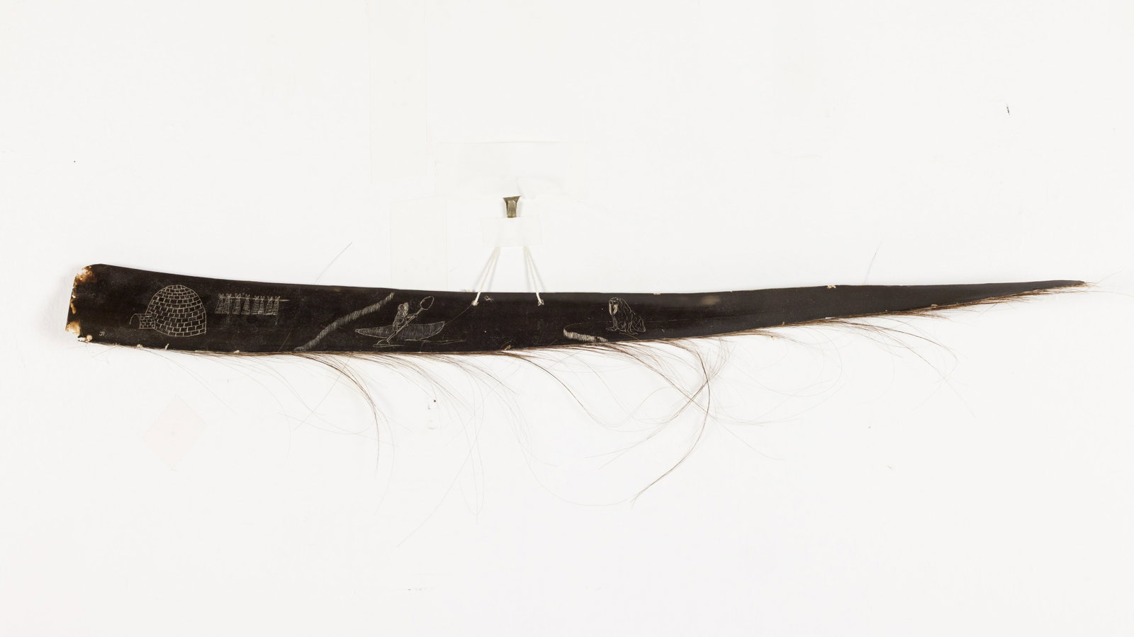 Etched Whale Baleen: Property of Private Collector, Bluffton, SC Description: Etched Whale Baleen, initial signed lower left, whale baleen etched with an igloo, a figure in canoe, and a walrus, drilled in middle for h
