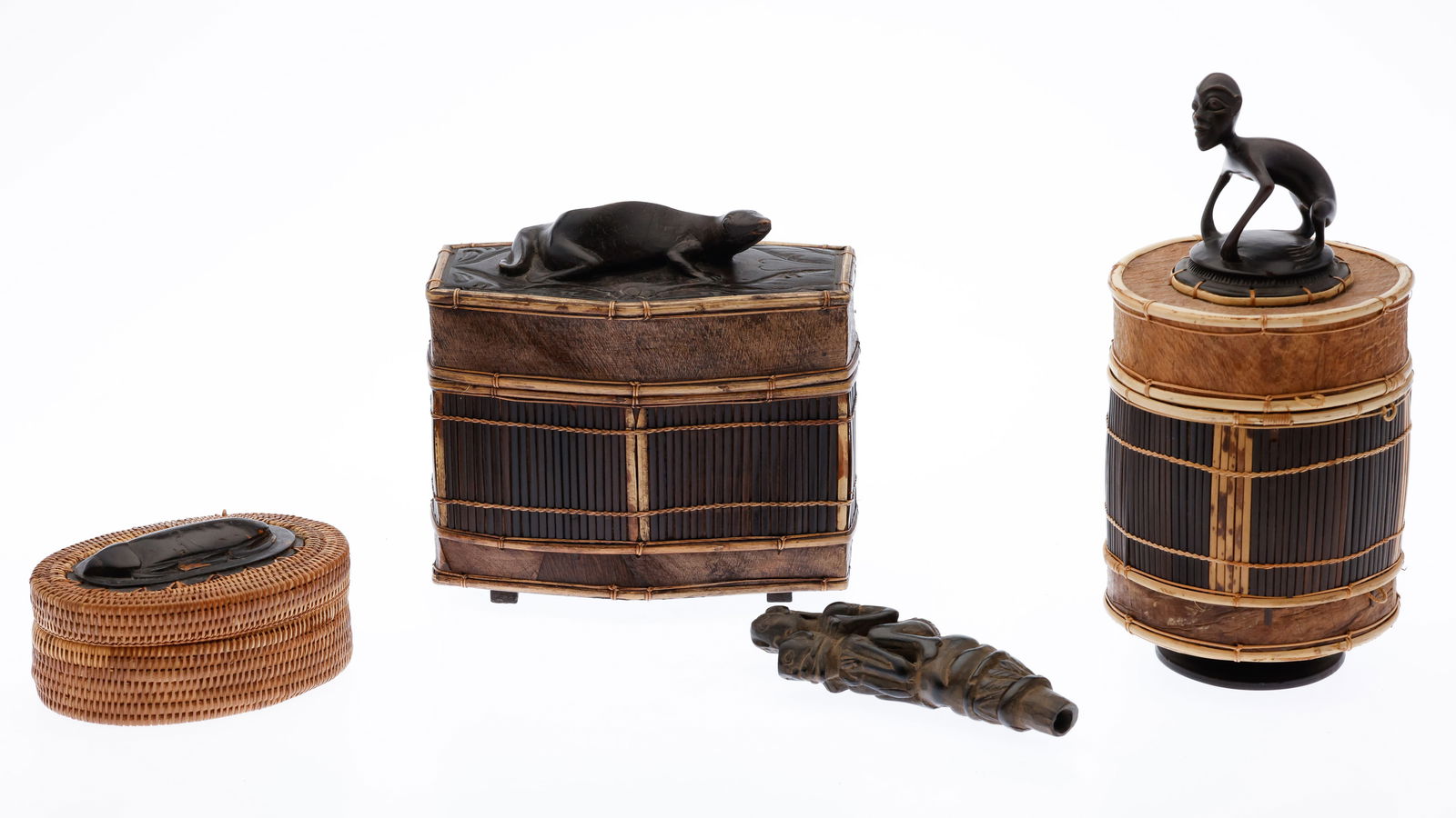 Four African Carved Wood and Woven Articles: Description: Four African Carved Wood and Woven Articles , comprising three woven and carved wood baskets and a carved wood figural article. Measurements: Height: of tallest 10