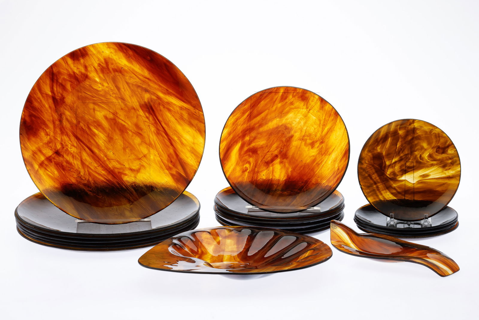 Set of Tortoise Shell Glass Plates: Property from a Private Collector, Spring Isand, GA and Philadelphia Description: Set of Tortoise Shell Glass Plates, comprising 7 dinner plates, 7 salad plates, 5 butter plates, a shell form serv