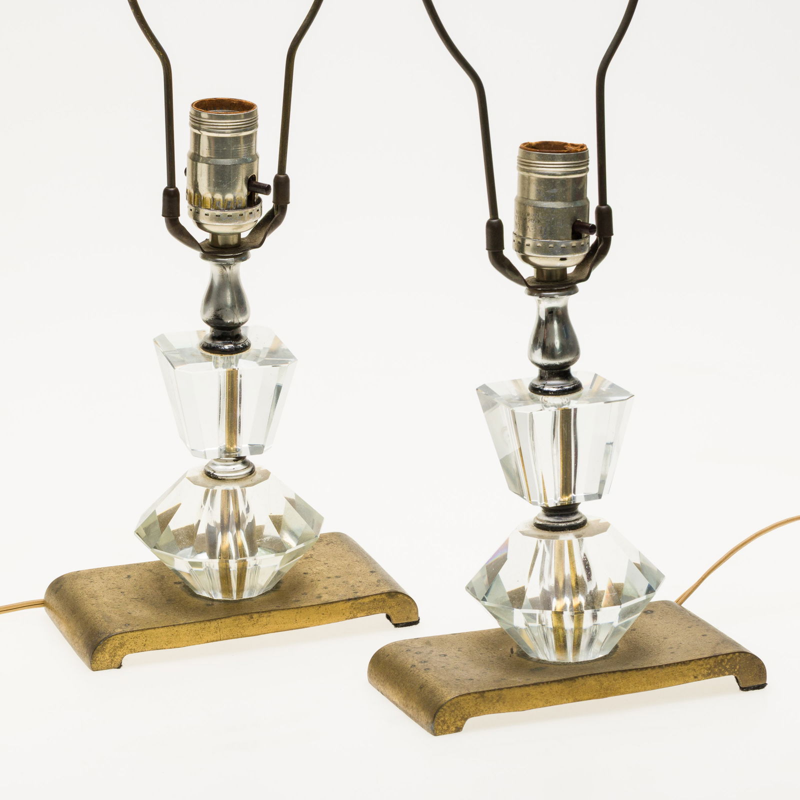 Pair of Crystal and Gilt Metal Lamps: Description: , the pair of lamps with cut glass crystals on rectangular gilt metal bases, numbered on undersides. Measurements: Height: overall with harp 23 in. x Width: 6 1/2