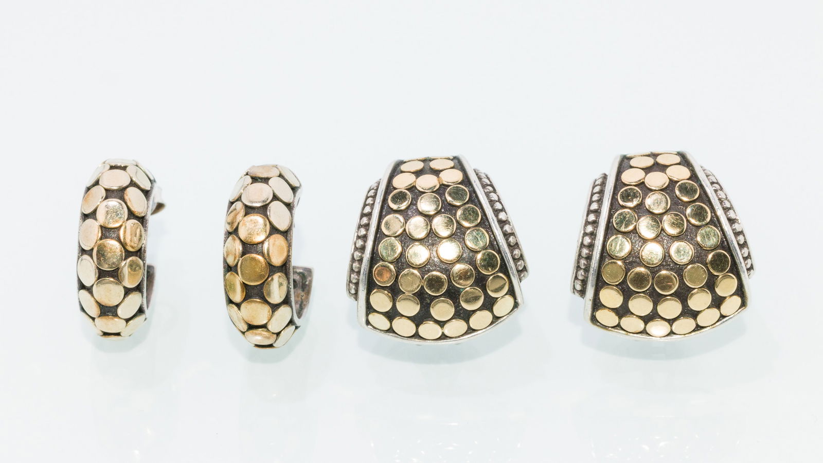 Two Pairs of John Hardy Sterling & Gold Earrings: Property of a Private Collector, Hilton head Island, SC Description: Two Pairs of John Hardy Sterling & Gold Earrings , a pair of sterling silver hoops with 18K gold polka-dots, hallmarked and mar