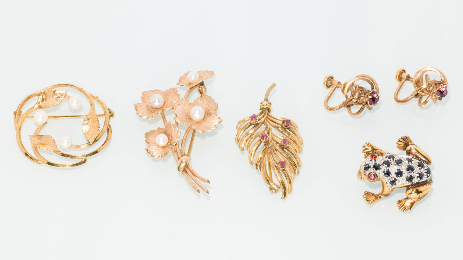 Group of 14K, 12K and Sterling Jewelry: Property of a Savannah Estate Description: Group of 14K, 12K and Sterling Jewelry, including a pair of 12K gold filled earrings with purple glass gems and twist backs; a 14K gold filled leaf brooc