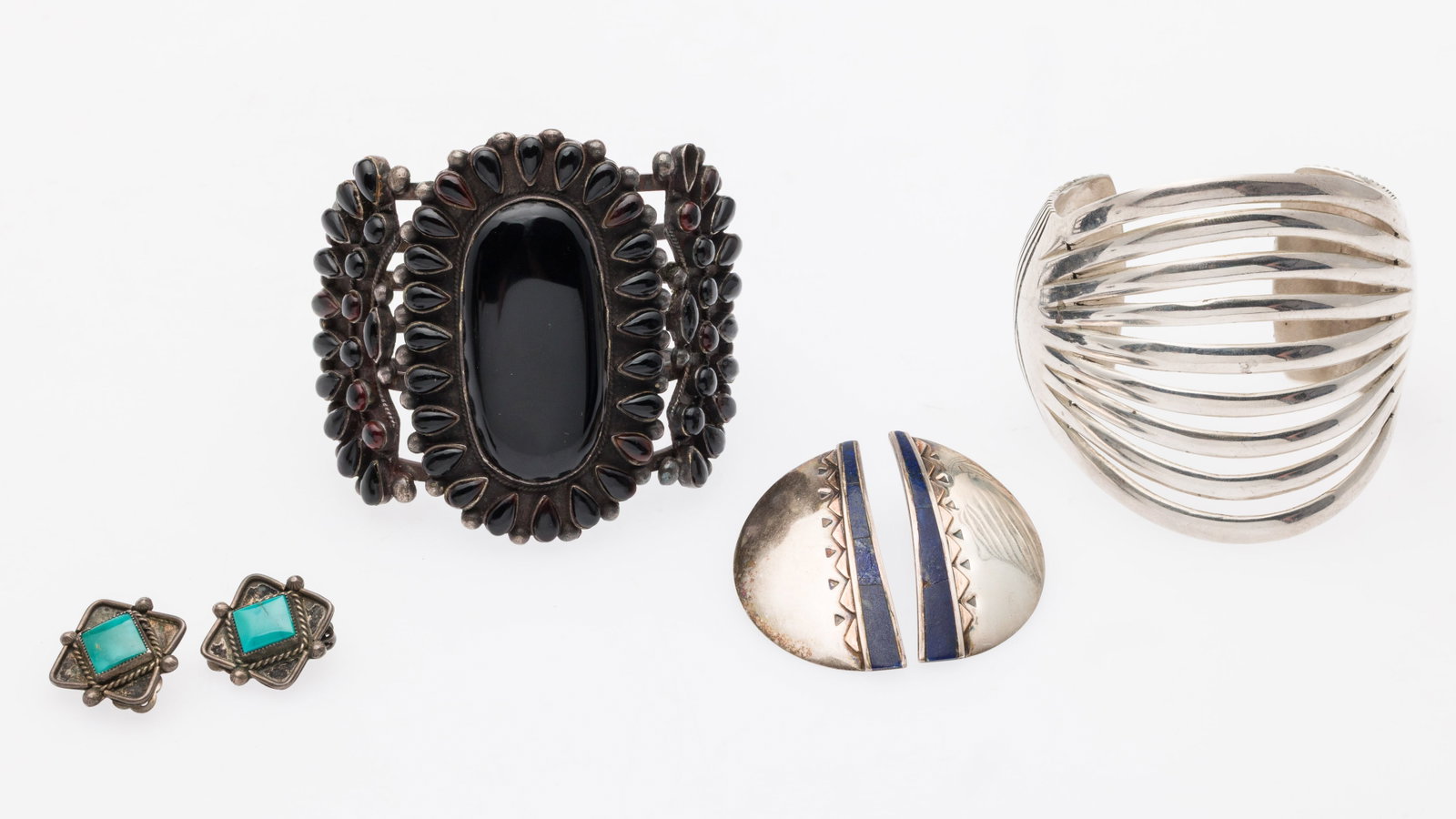 2 Native American Silver Cuffs & 2 Pairs of Earrings: Description: Two Native American Silver Cuffs and Two Pairs of Earrings, comprising Bighand sterling silver cuff (signed and marked 'sterling' on back); another unmarked cuff with black enamel se