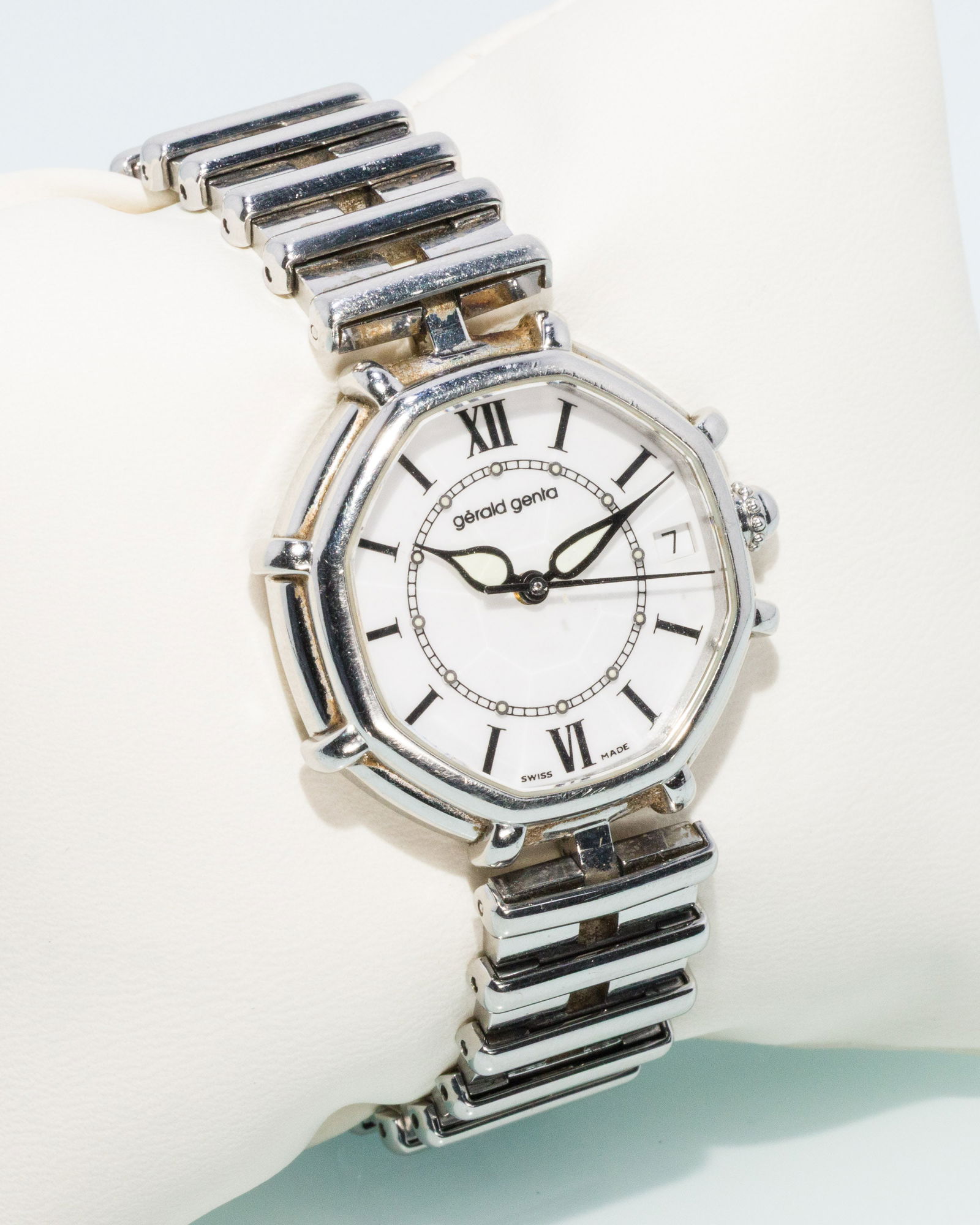 Gerald Genta "Success" Stainless Steel Watch: Description: Gerald Genta "Success" Automatic Stainless Steel Watch, stainless steel case and bracelet with octagonal faceted face, the white dial with roman numerals and date aperture, marked on