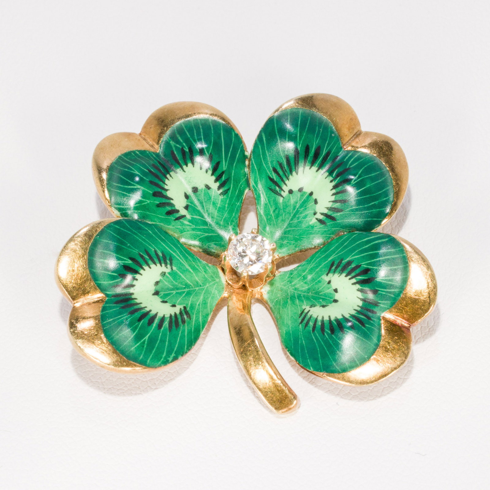 10K Gold & Diamond Four Leaf Clover Brooch: Description: 10K Gold & Diamond Four Leaf Clover Brooch, yellow gold and painted enamel clover pin/pendant featuring an approx. 4.2 mm round diamond, unmarked, tests 10K. 14.59 grams overall. <